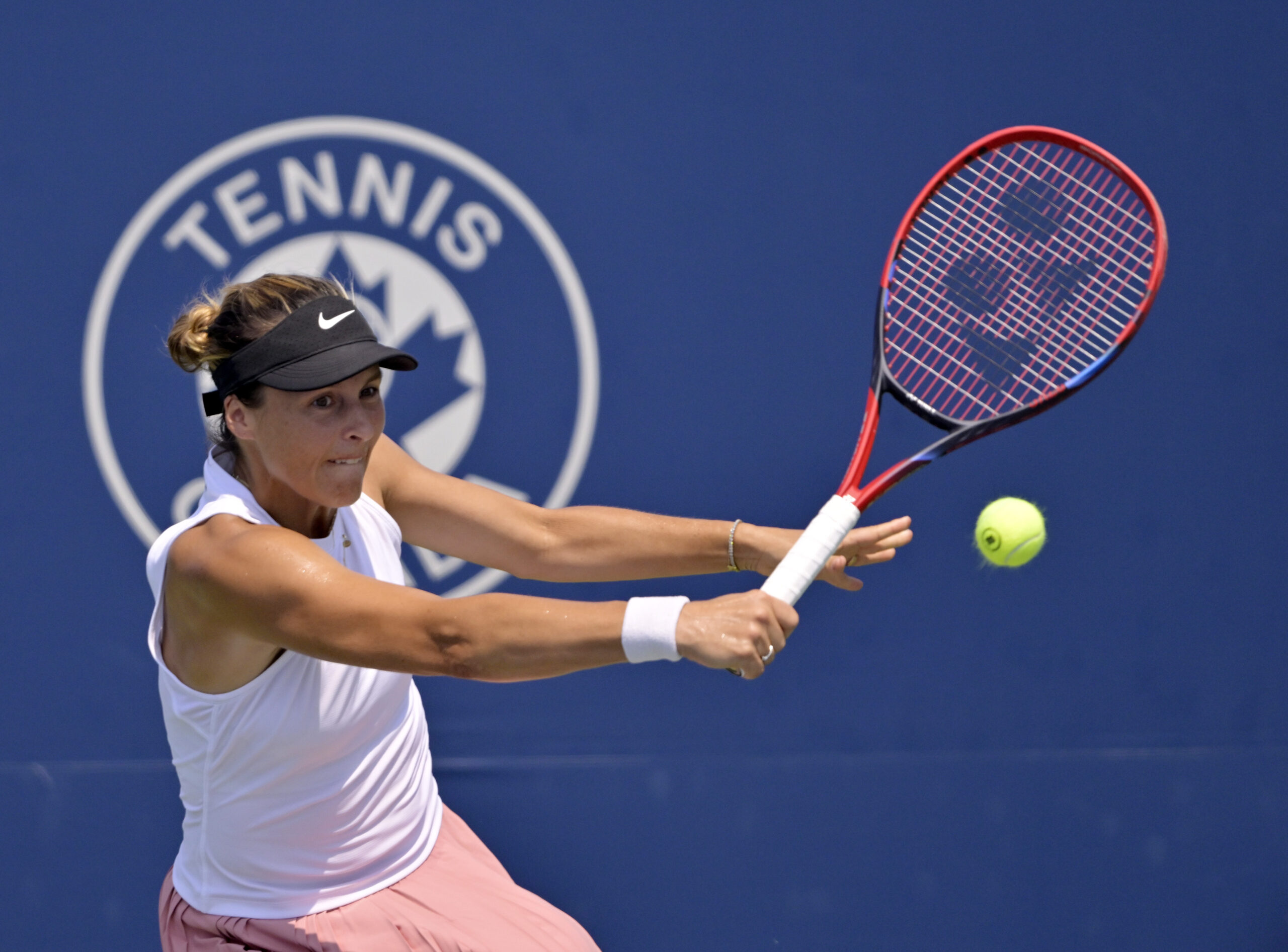 Jul 28, 2025; Montreal, QC, Canada; Tatjana Maria (GER) reacts returns the ball against Laura Siegemund (GER) in first round play at IGA Stadium. Mandatory Credit: Eric Bolte-Imagn Images
