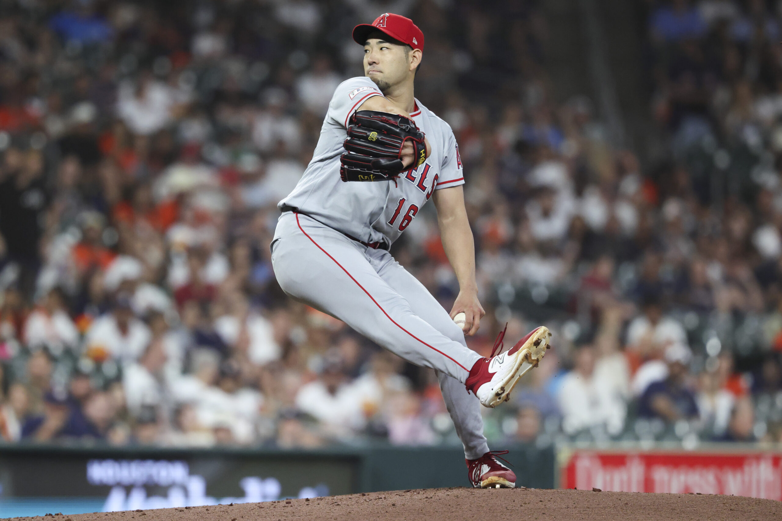 Mar 27, 2026; Houston, Texas, USA; Los Angeles Angels starting pitcher Yusei Kikuchi (16) delivers a pitch during the first inning against the Houston Astros at Daikin Park. Mandatory Credit: Troy Taormina-Imagn Images