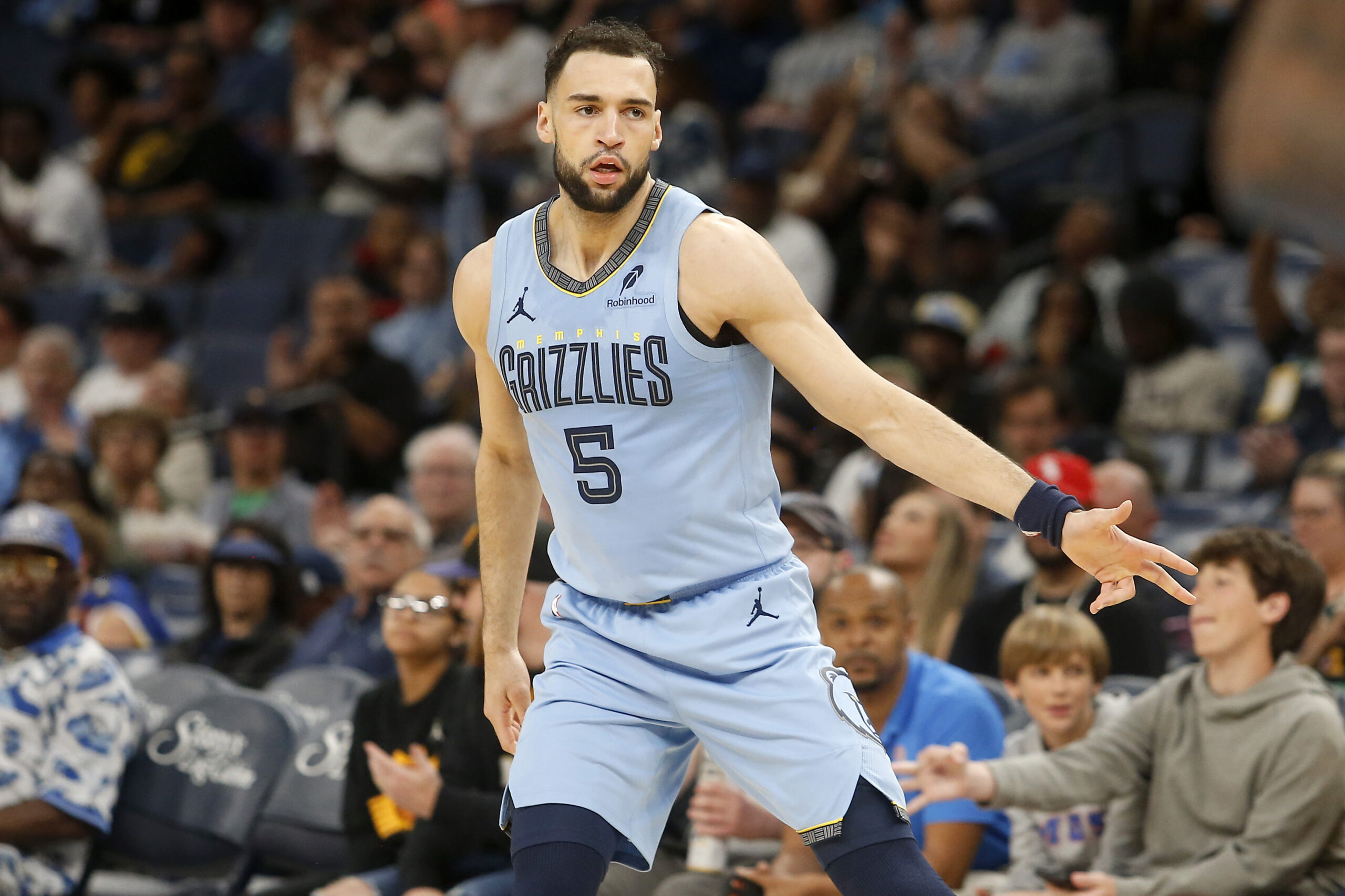 Mar 30, 2026; Memphis, Tennessee, USA; Memphis Grizzlies forward Tyler Burton (5) reacts during the third quarter against the Phoenix Suns at FedExForum. Mandatory Credit: Petre Thomas-Imagn Images