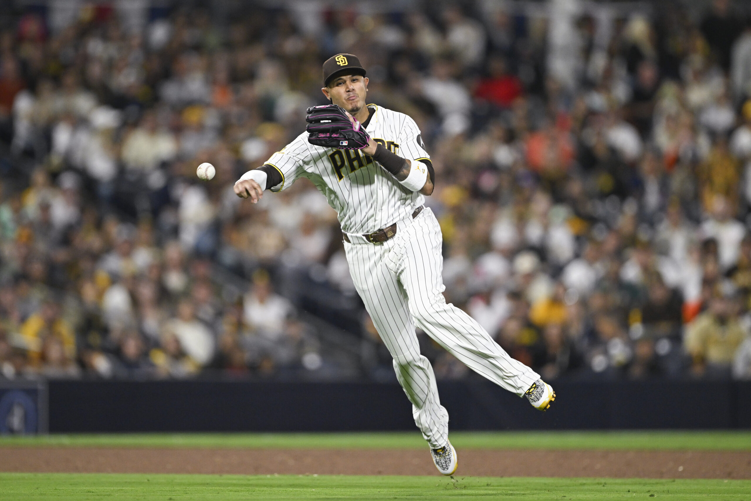 Mar 30, 2026; San Diego, California, USA; San Diego Padres third baseman Manny Machado (13) throws out San Francisco Giants third baseman Matt Chapman (26) during the sixth inning at Petco Park. Mandatory Credit: Denis Poroy-Imagn Images