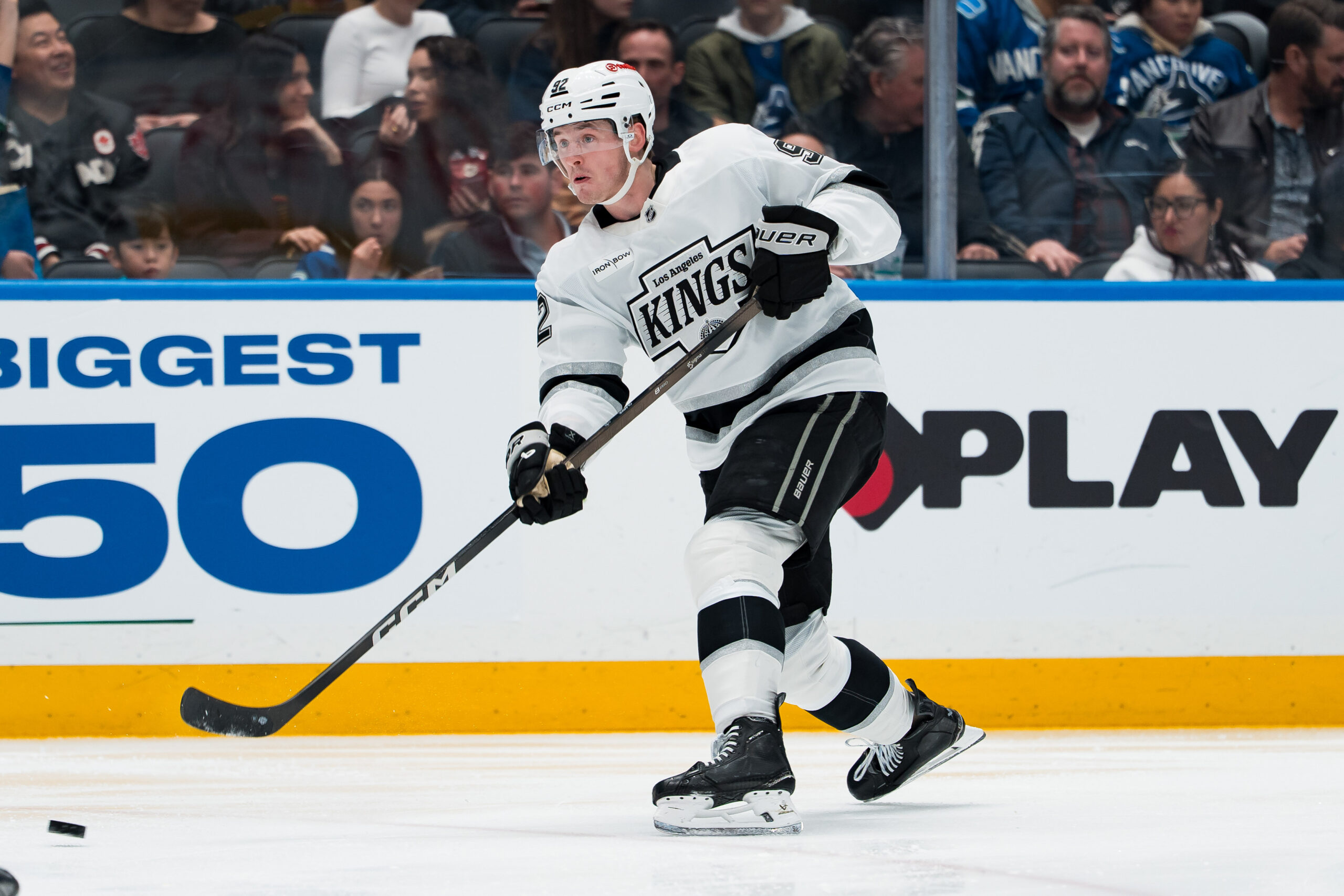 Mar 26, 2026; Vancouver, British Columbia, CAN; Los Angeles Kings defenseman Brandt Clarke (92) shoots against the Vancouver Canucks in the third period at Rogers Arena. Mandatory Credit: Bob Frid-Imagn Images