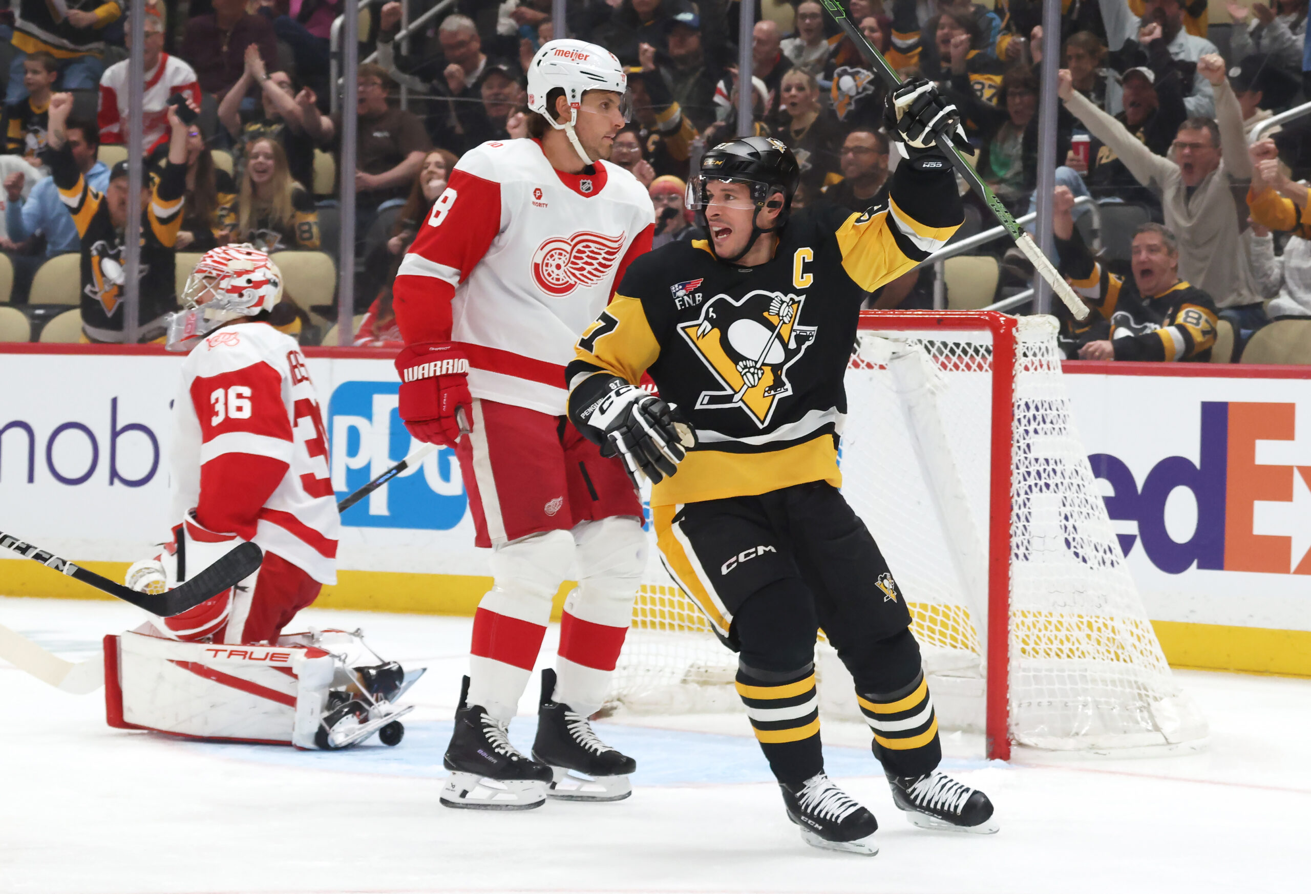 Mar 31, 2026; Pittsburgh, Pennsylvania, USA;  Pittsburgh Penguins center Sidney Crosby (87) reacts to a goal by Pittsburgh right wing Rickard Rakell (not pictured) during the first period against the Detroit Red Wings at PPG Paints Arena. Mandatory Credit: Charles LeClaire-Imagn Images