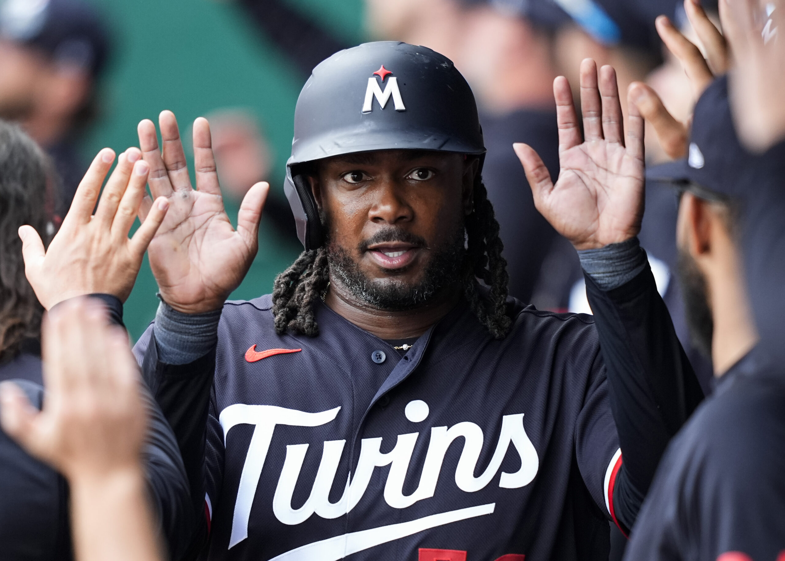 Apr 2, 2026; Kansas City, Missouri, USA; Minnesota Twins first baseman Josh Bell (56) is congratulated by teammates after scoring a run during the eighth inning against the Kansas City Royals at Kauffman Stadium. Mandatory Credit: Jay Biggerstaff-Imagn Images