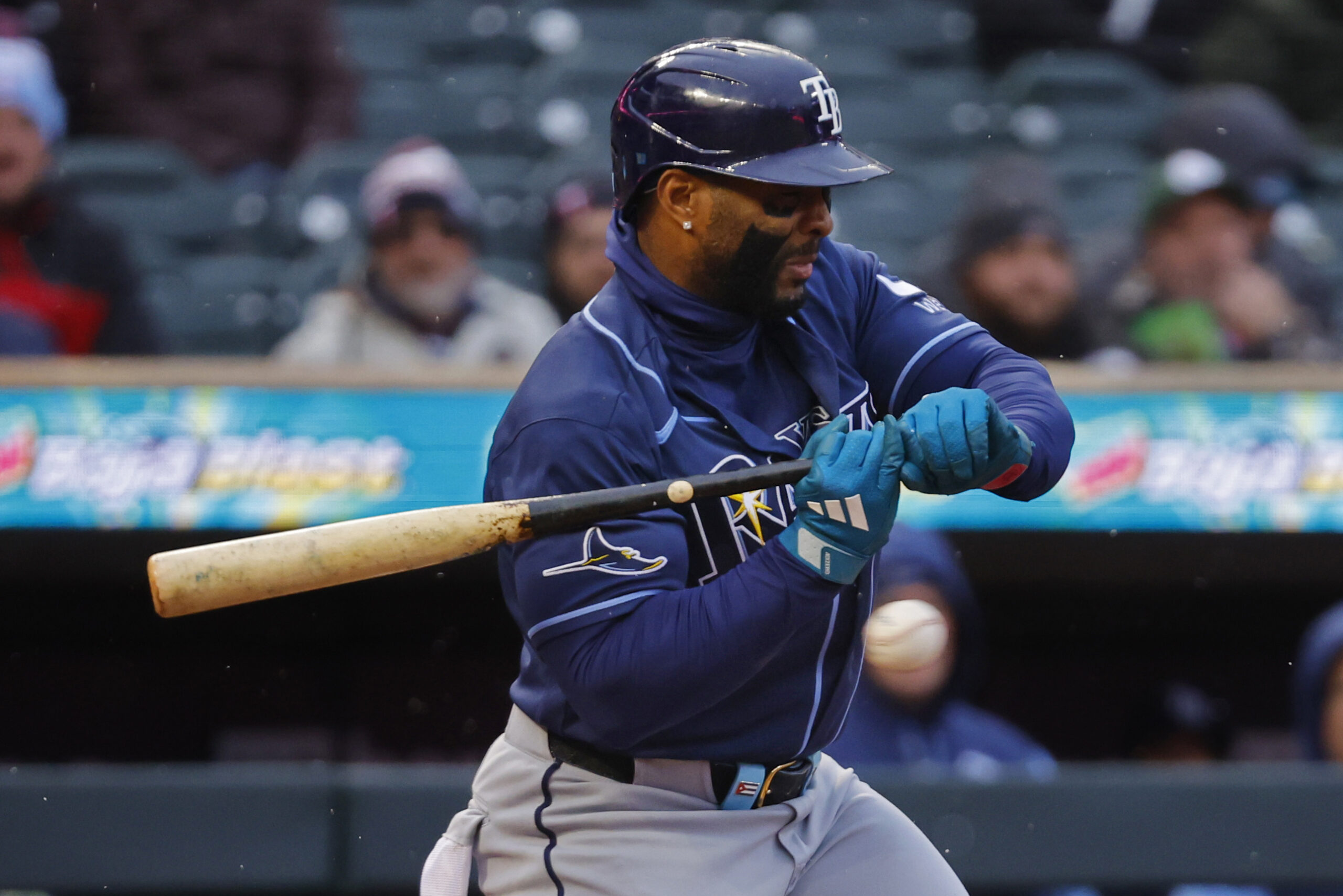 Apr 4, 2026; Minneapolis, Minnesota, USA; Tampa Bay Rays first baseman Yandy Diaz (2) gets hit by a pitch for an RBI against the Minnesota Twins in the second inning at Target Field. Mandatory Credit: Bruce Kluckhohn-Imagn Images