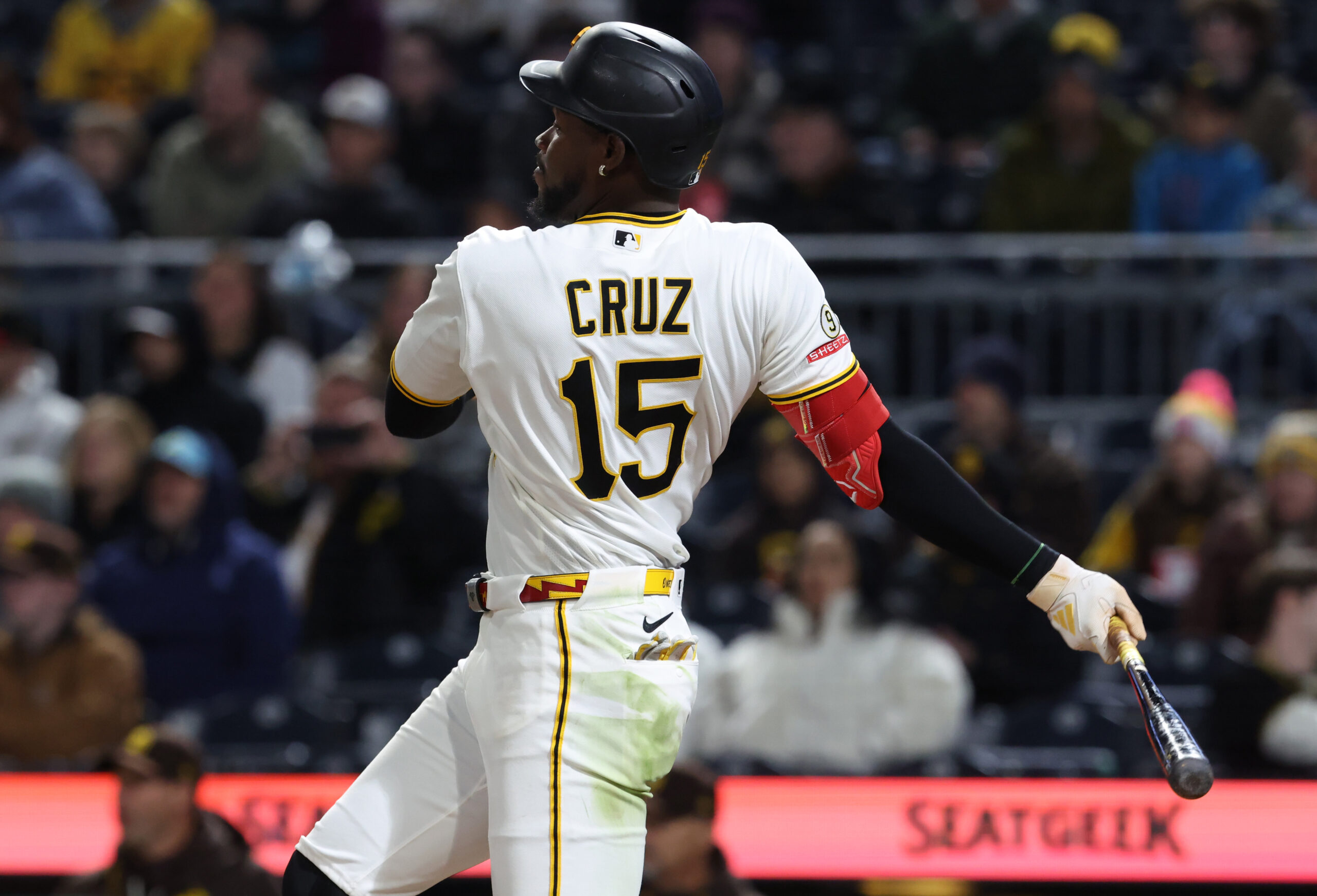 Apr 6, 2026; Pittsburgh, Pennsylvania, USA;  Pittsburgh Pirates center fielder Oneil Cruz (15) hits a single against the San Diego Padres during the fifth inning at PNC Park. Mandatory Credit: Charles LeClaire-Imagn Images