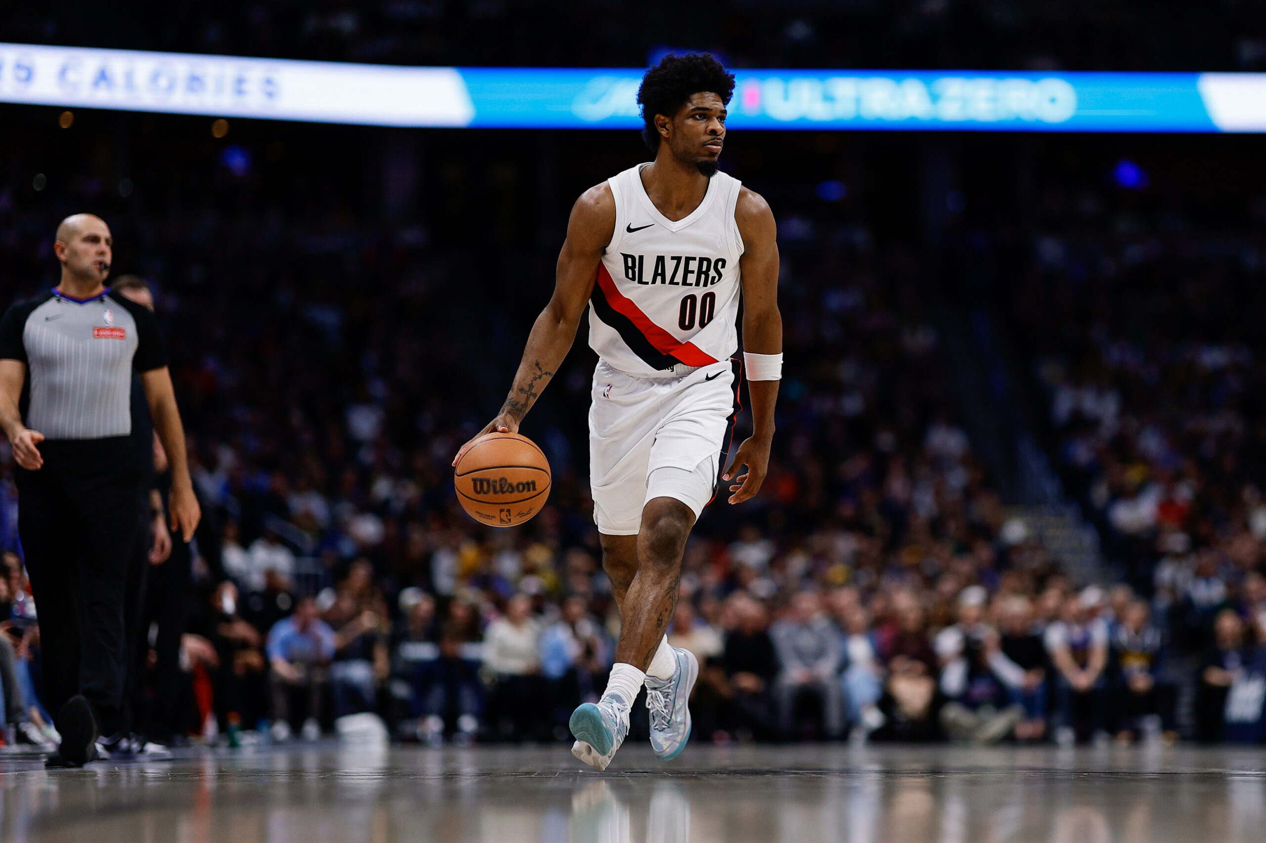 Apr 6, 2026; Denver, Colorado, USA; Portland Trail Blazers guard Scoot Henderson (00) dribbles the ball up court in the fourth quarter against the Denver Nuggets at Ball Arena. Mandatory Credit: Isaiah J. Downing-Imagn Images