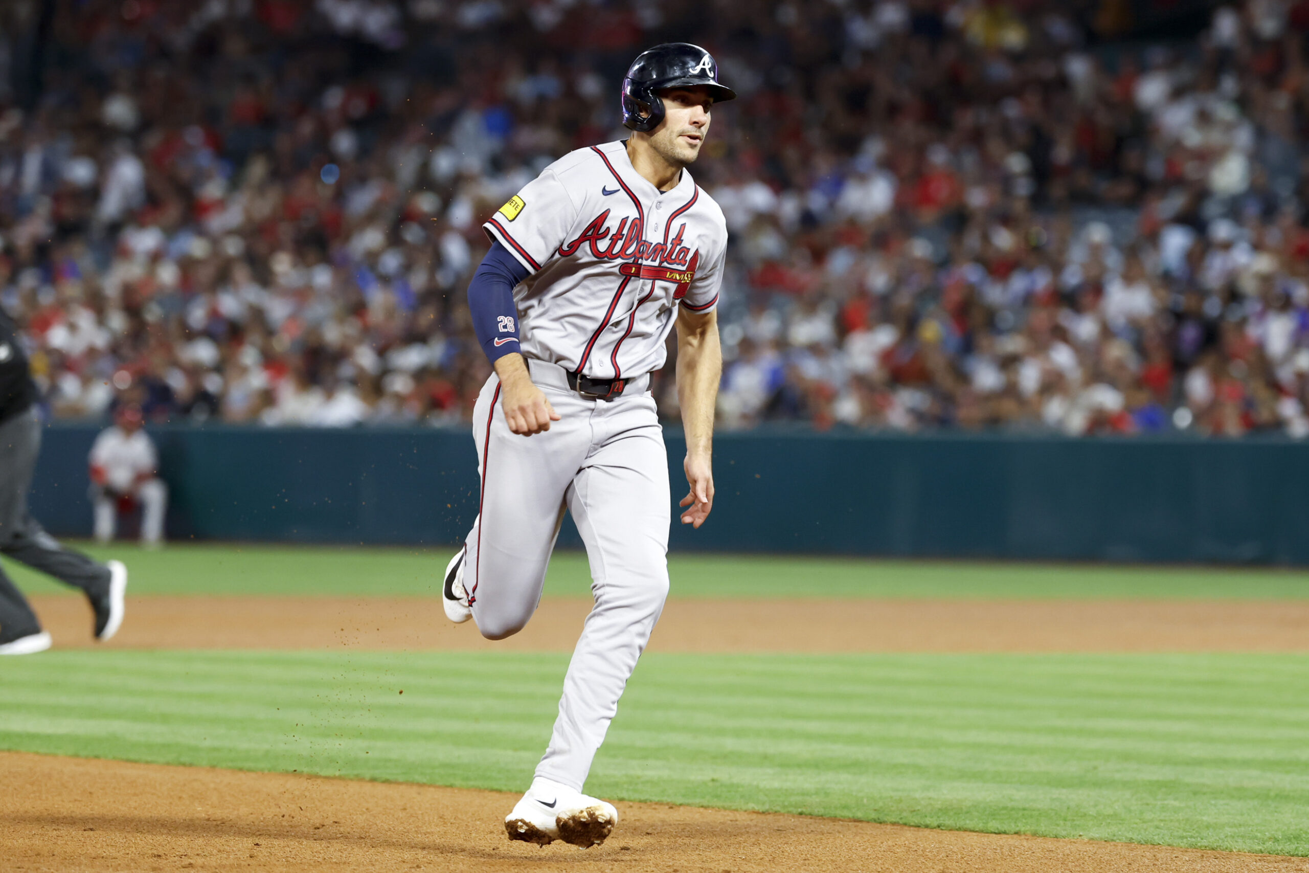 kApr 7, 2026; Anaheim, California, USA; Atlanta Braves first baseman Matt Olson (28) runs to third during the fourth inning against the Los Angeles Angels at Angel Stadium. Mandatory Credit: William Navarro-Imagn Images