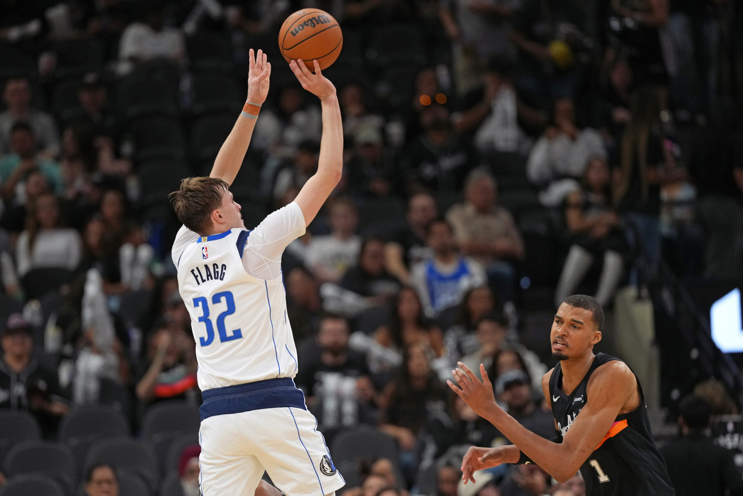 Apr 10, 2026; San Antonio, Texas, USA;  Dallas Mavericks forward Cooper Flagg (32) shoots over San Antonio Spurs forward Victor Wembanyama (1) during the second half at Frost Bank Center. Mandatory Credit: Scott Wachter-Imagn Images