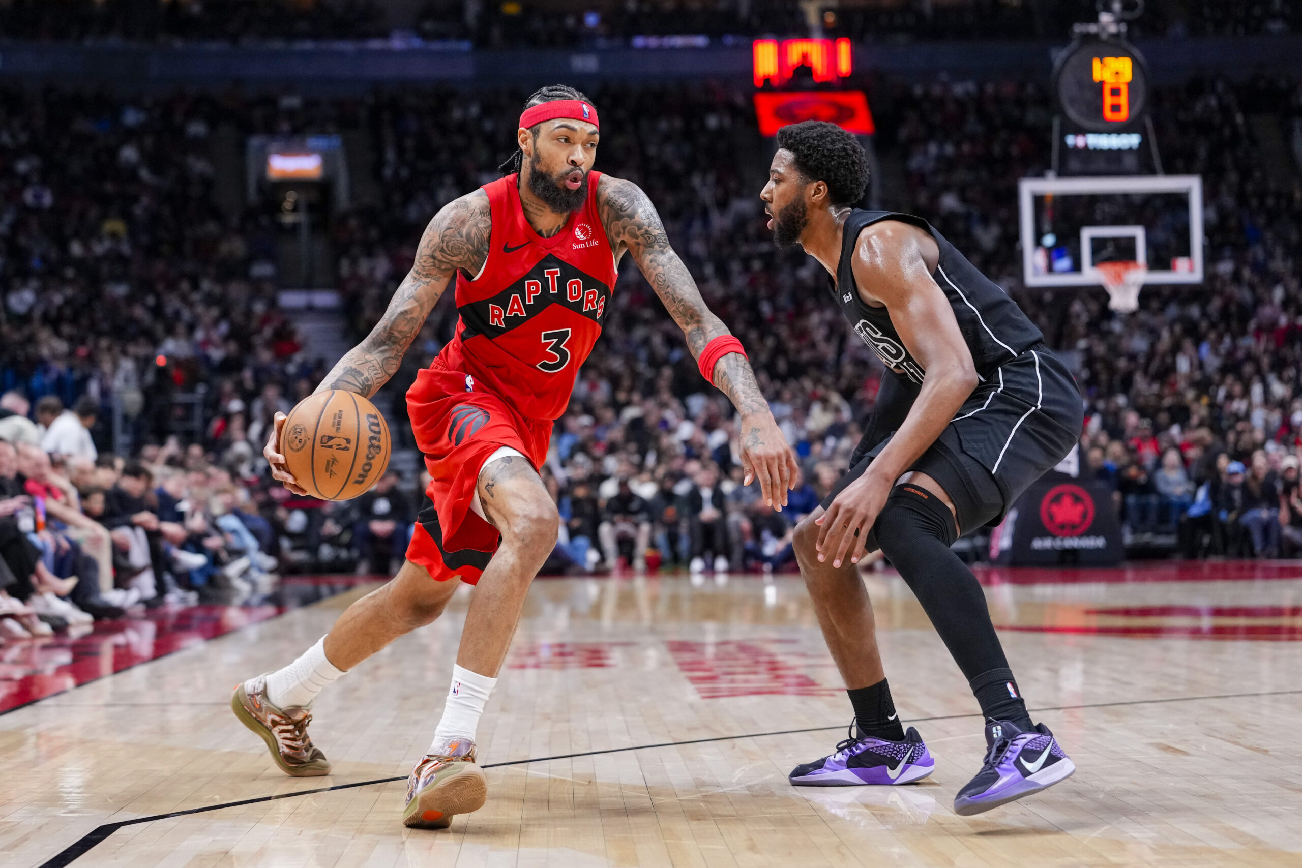 Apr 12, 2026; Toronto, Ontario, CAN;  Toronto Raptors Brandon Ingram (3) dribbles against Brooklyn Nets Chaney Johnson (31) during the second half at Scotiabank Arena. Mandatory Credit: Kevin Sousa-Imagn Images