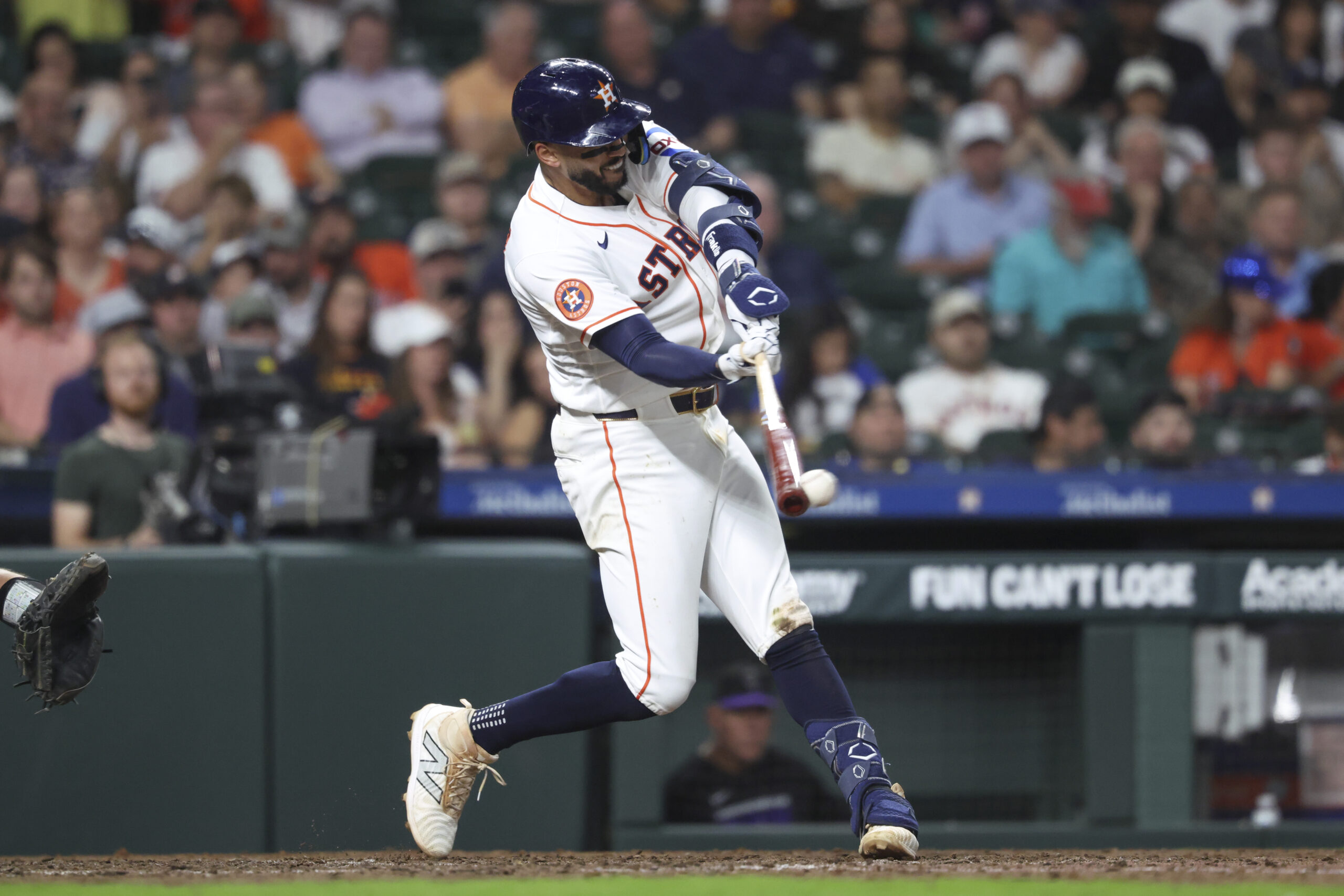 Apr 14, 2026; Houston, Texas, USA; Houston Astros shortstop Carlos Correa (1) hits a single during the seventh inning against the Colorado Rockies at Daikin Park. Mandatory Credit: Troy Taormina-Imagn Images