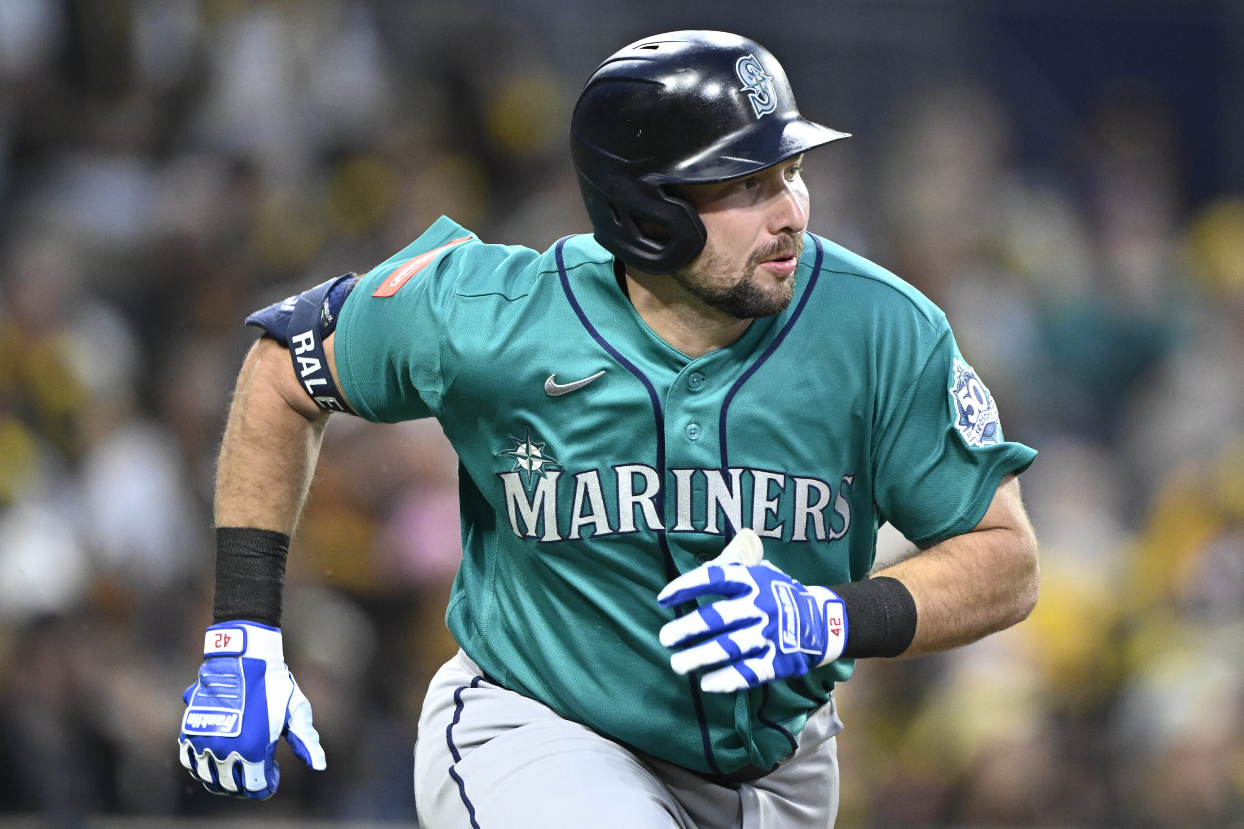 Apr 15, 2026; San Diego, California, USA; Seattle Mariners catcher Cal Raleigh hits a double during the third inning against the San Diego Padres at Petco Park. All MLB players are wearing number 42 today to honor Jackie Robinson. Mandatory Credit: Denis Poroy-Imagn Images