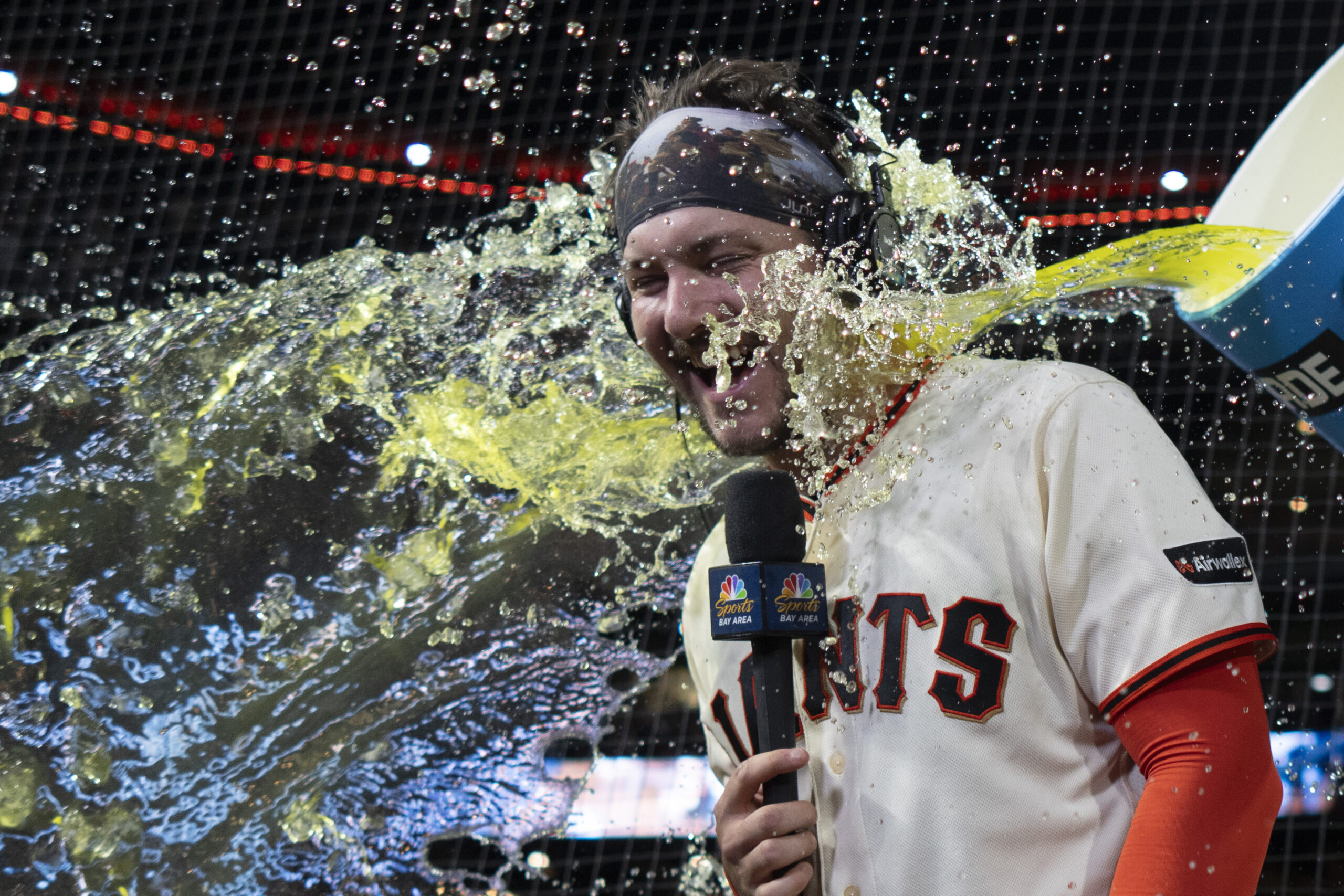 Apr 22, 2026; San Francisco, California, USA;  San Francisco Giants catcher Patrick Bailey (14) gets splashed after defeating the Los Angeles Dodgers at Oracle Park. Mandatory Credit: Stan Szeto-Imagn Images