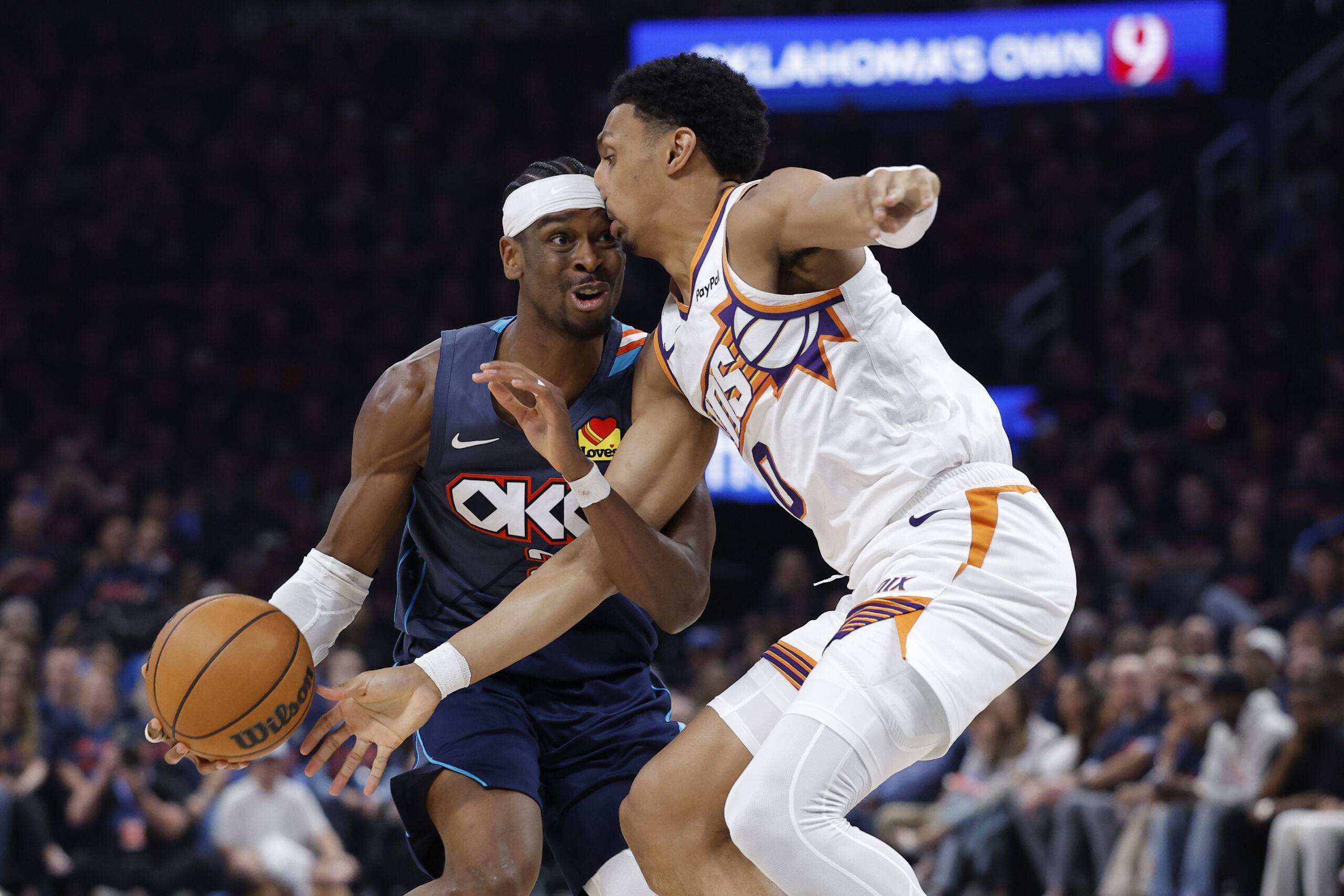 Apr 22, 2026; Oklahoma City, Oklahoma, USA; Oklahoma City Thunder guard Shai Gilgeous-Alexander (2) and Phoenix Suns forward Ryan Dunn (0) run into each other on a drive in the second half during game two of the first round of the 2026 NBA Playoffs at Paycom Center. Mandatory Credit: Alonzo Adams-Imagn Images