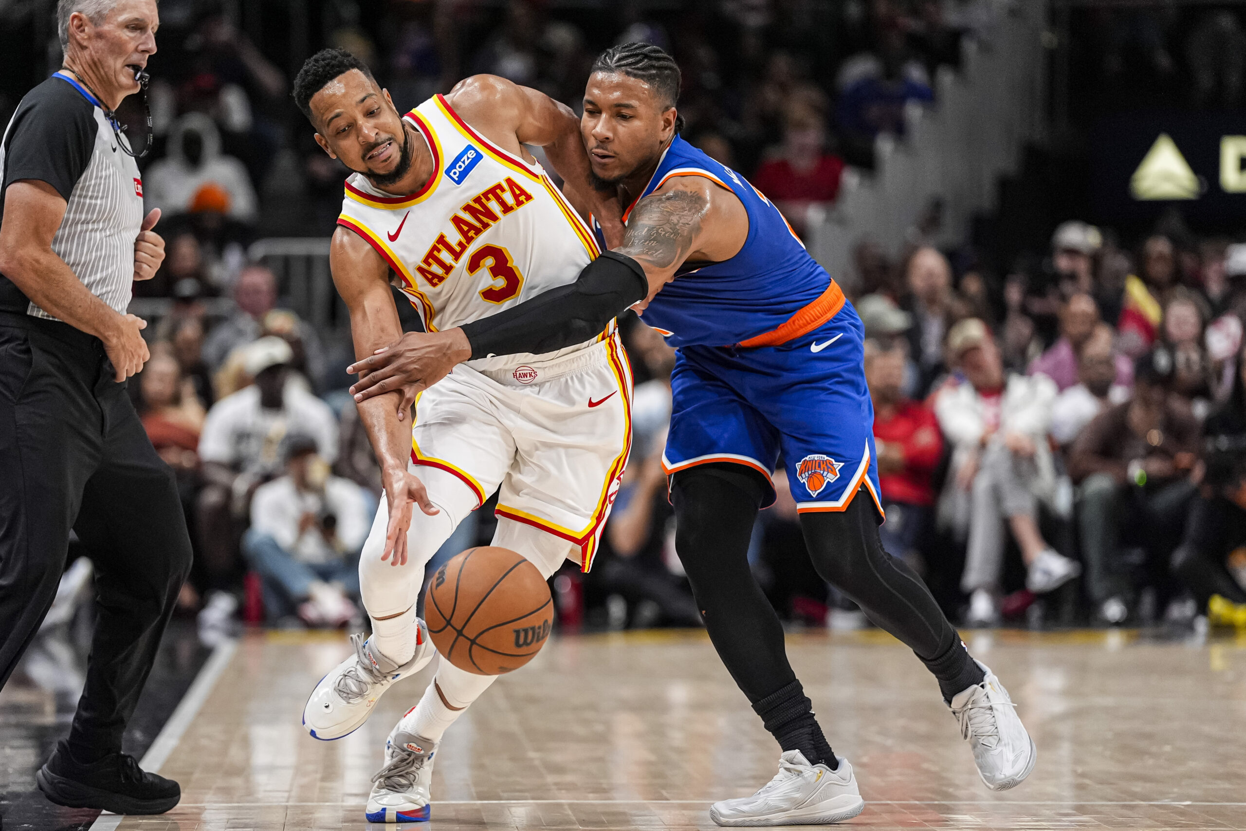 Apr 25, 2026; Atlanta, Georgia, USA; Atlanta Hawks guard CJ McCollum (3) and New York Knicks guard Miles McBride (2) fight for control of the ball during the second half during game four of the first round of the 2026 NBA Playoffs at State Farm Arena. Mandatory Credit: Dale Zanine-Imagn Images