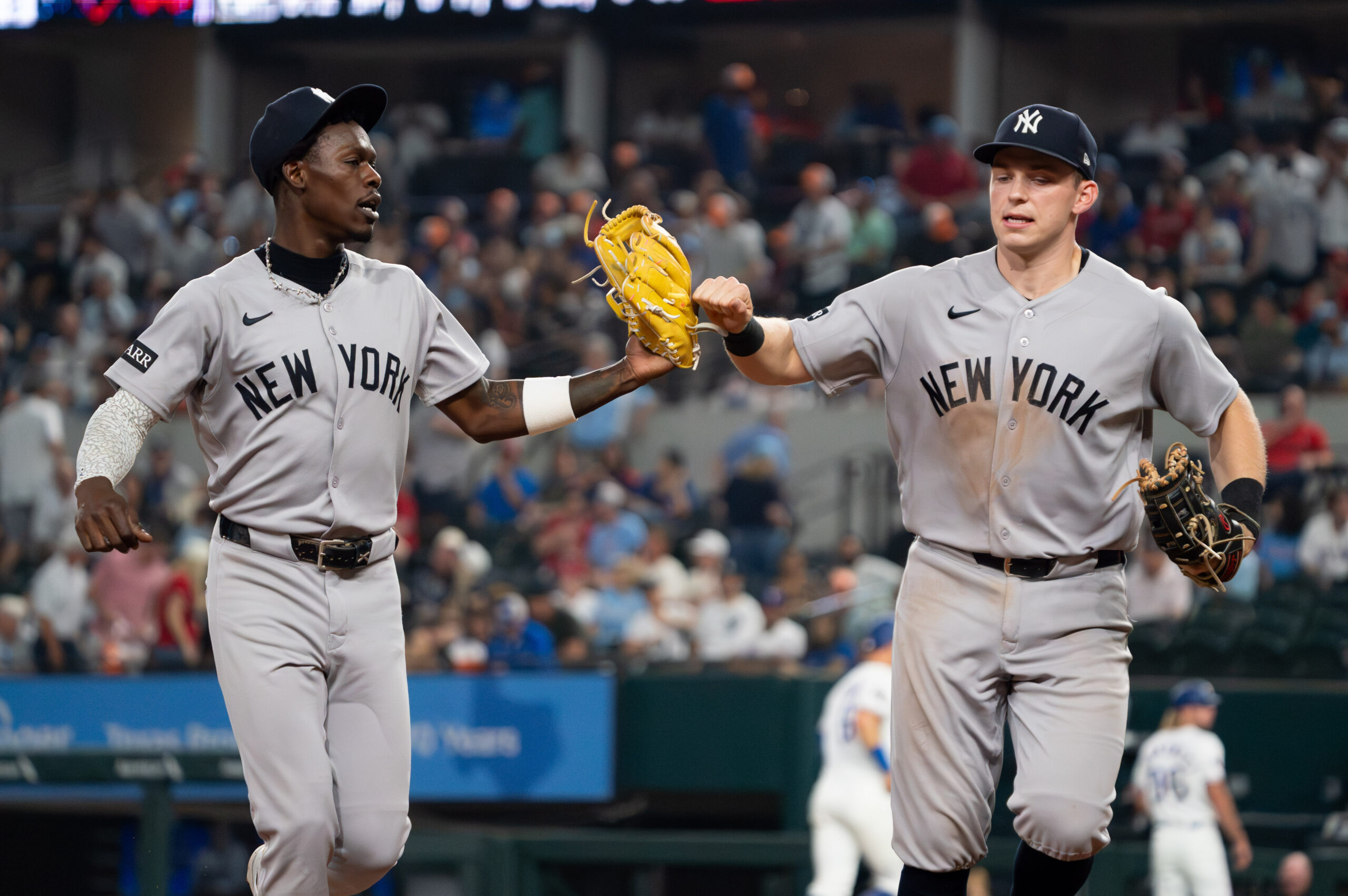 Apr 27, 2026; Arlington, Texas, USA;  New York Yankees second baseman Jazz Chisholm Jr. (13) and first baseman Ben Rice (22) fist bump as they run off the field after the eighth inning against the Texas Rangers at Globe Life Field. Mandatory Credit: Raymond Carlin III-Imagn Images
