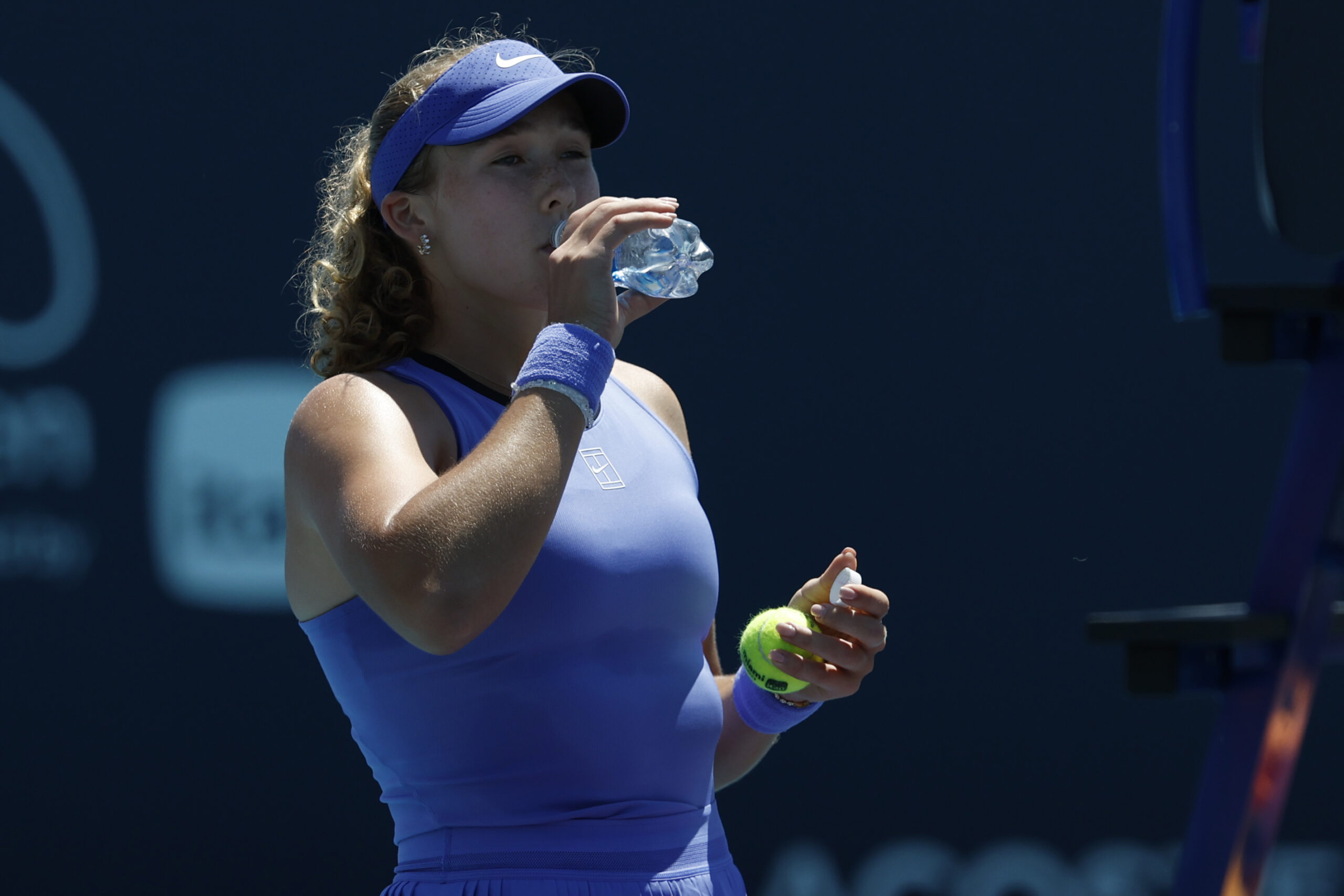 Mar 23, 2026; Miami Gardens, FL, USA; Mirra Andreeva takes a drink of water during a changeover against Victoria Mboko (CAN) (not pictured) on day 7 of the 2026 Miami Open at Hard Rock Stadium. Mandatory Credit: Geoff Burke-Imagn Images