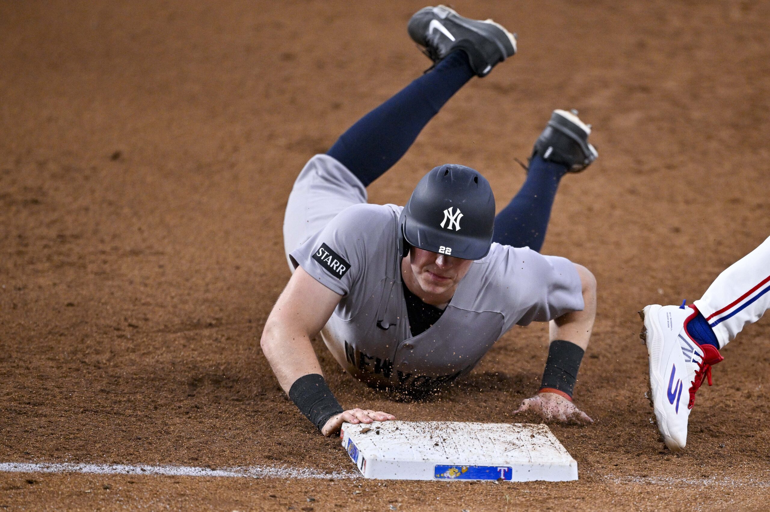 Apr 29, 2026; Arlington, Texas, USA; New York Yankees first baseman Ben Rice (22) is tagged out at first base during the game between the Rangers and the Yankees at Globe Life Field. Mandatory Credit: Jerome Miron-Imagn Images