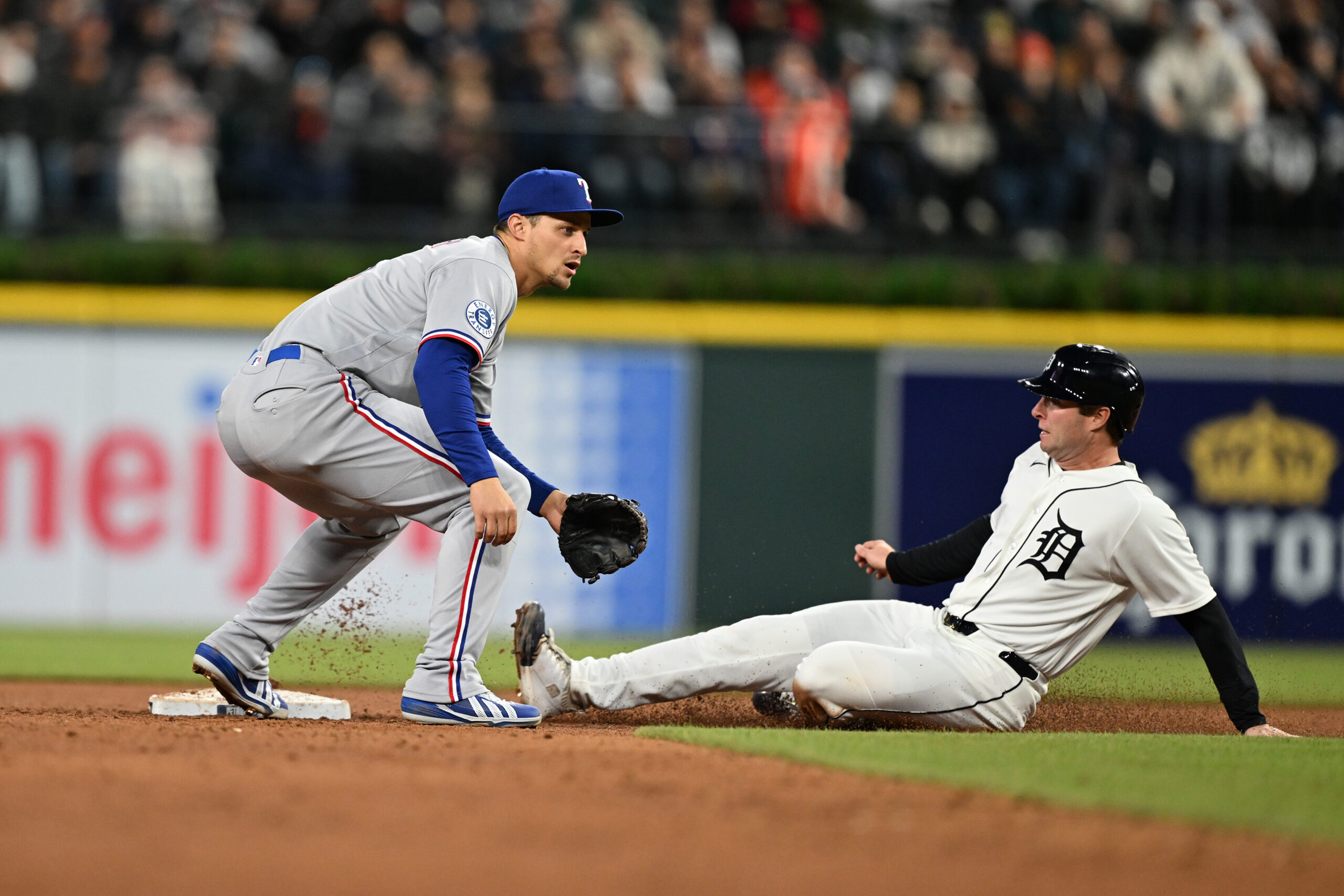 May 2, 2026; Detroit, Michigan, USA;  Detroit Tigers third baseman Colt Keith (33) steals second base ahead of the throw to Texas Rangers shortstop Corey Seager (5) in the fifth inning at Comerica Park. Mandatory Credit: Lon Horwedel-Imagn Images