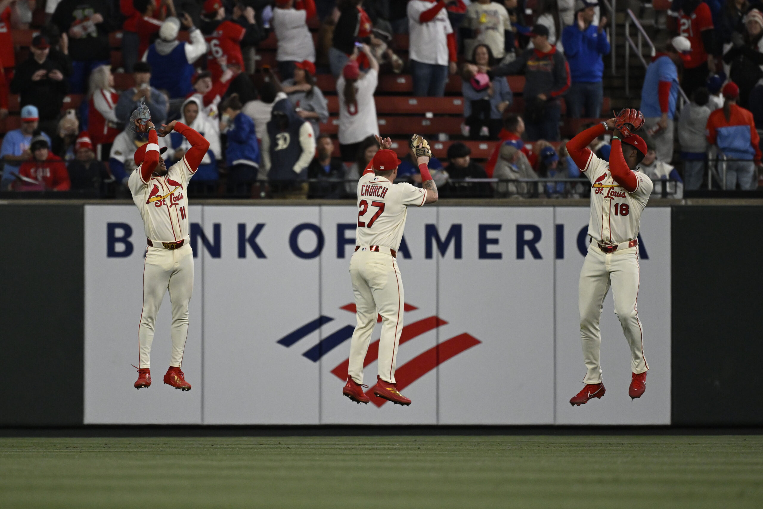 May 2, 2026; St. Louis, Missouri, USA; St. Louis Cardinals center fielder Victor Scott II (11), St. Louis Cardinals left fielder Nathan Church (27) and St. Louis Cardinals right fielder Jordan Walker (18) celebrate after beating the Los Angeles Dodgers at Busch Stadium. Mandatory Credit: Joe Puetz-Imagn Images