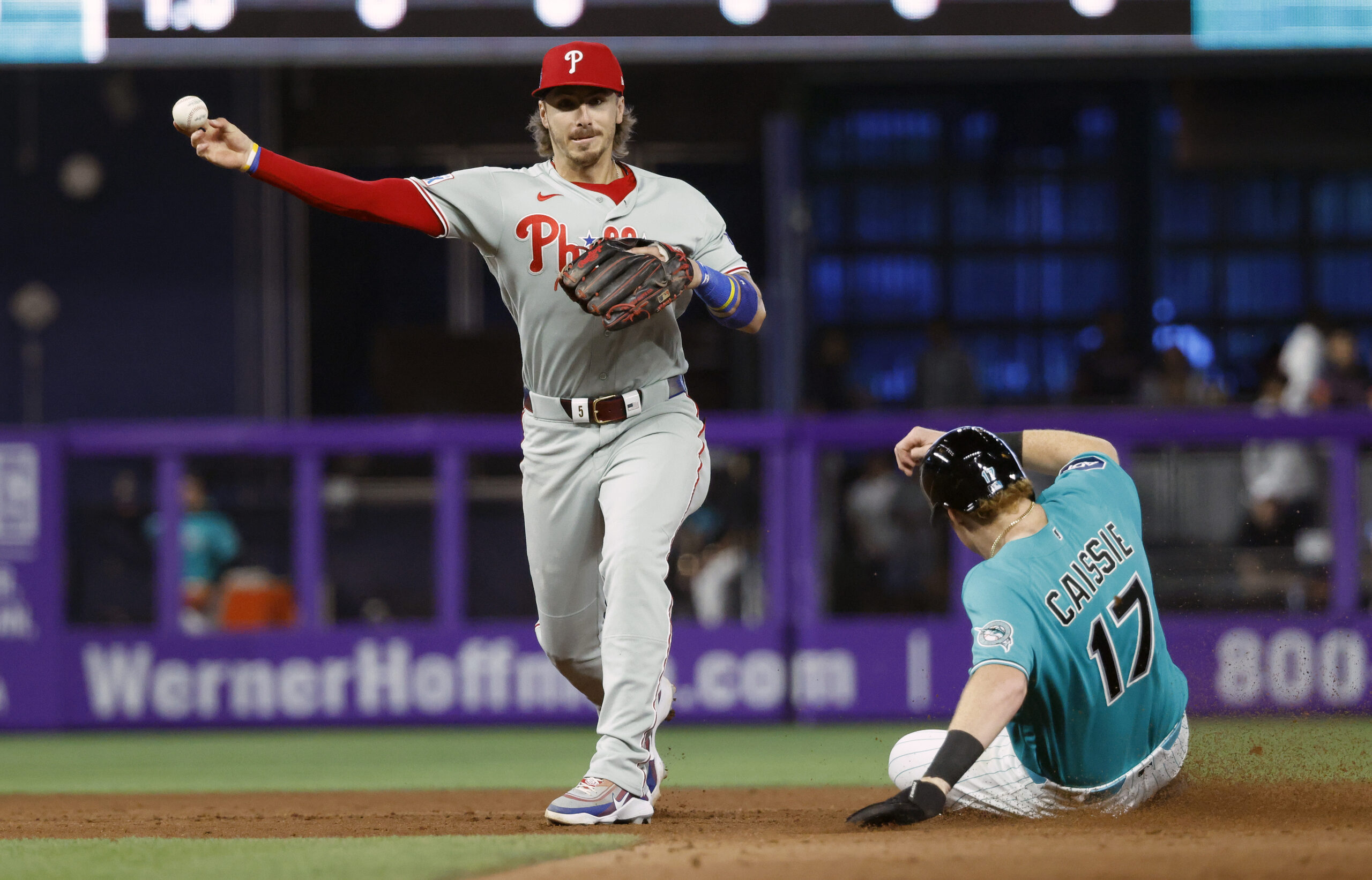 May 3, 2026; Miami, Florida, USA;  Miami Marlins right fielder Owen Caissie (17) is out at second base as Philadelphia Phillies second baseman Bryson Stott (5) throws to first for the double play during the eighth inning at loanDepot Park. Mandatory Credit: Rhona Wise-Imagn Images