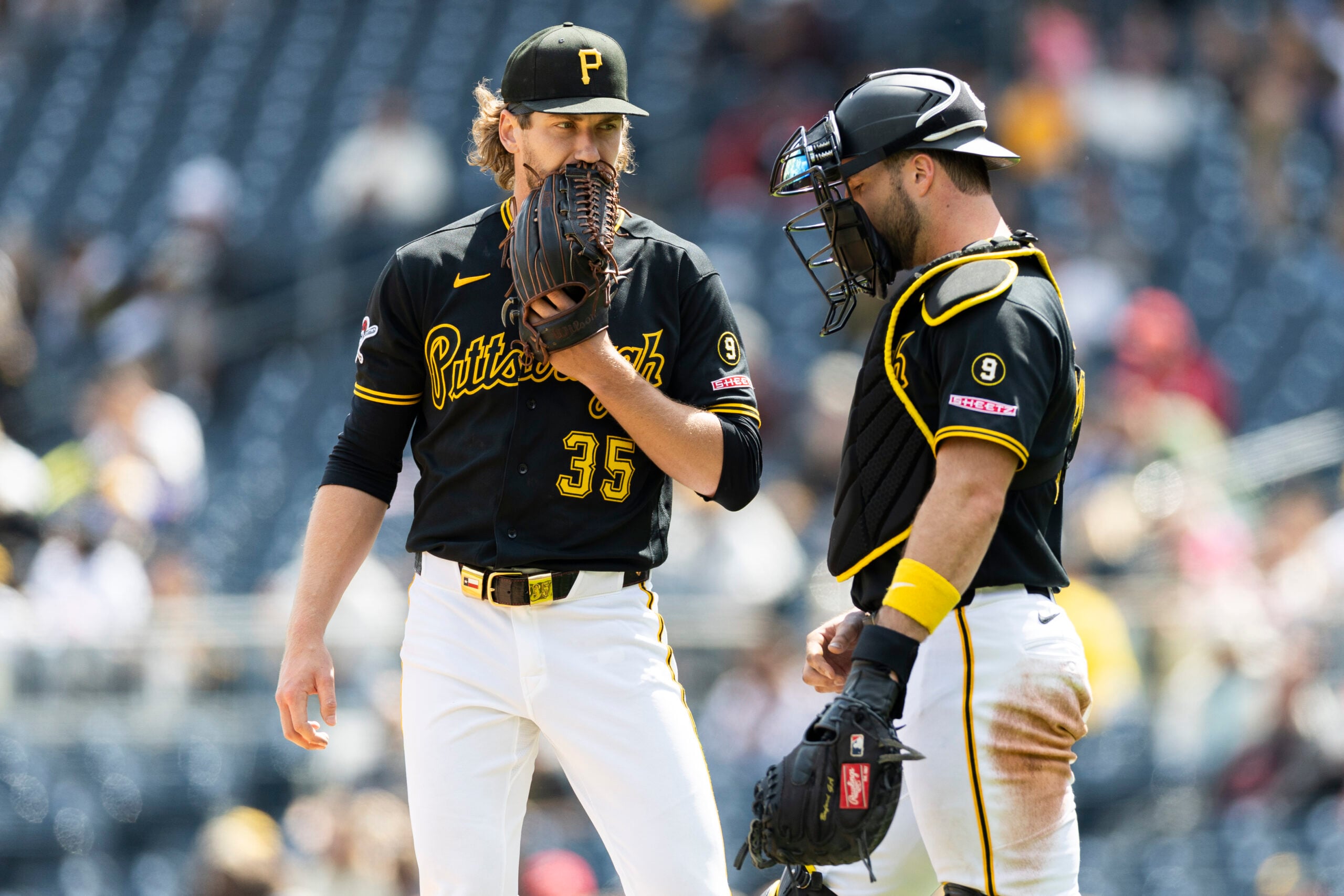 May 3, 2026; Pittsburgh, Pennsylvania, USA; Pittsburgh Pirates starting pitcher Braxton Ashcraft (35) talks with catcher Joey Bart (14) during the seventh inning at PNC Park. Mandatory Credit: Scott Galvin-Imagn Images