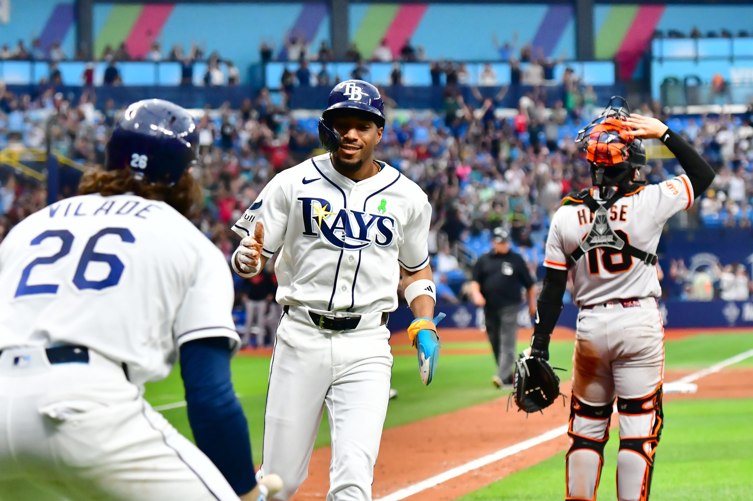 May 3, 2026; St. Petersburg, Florida, USA; Tampa Bay Rays outfielder Chandler Simpson (14) scores the last run during the tenth inning against San Francisco Giants at Tropicana Field. Mandatory Credit: Pablo Robles-Imagn Images