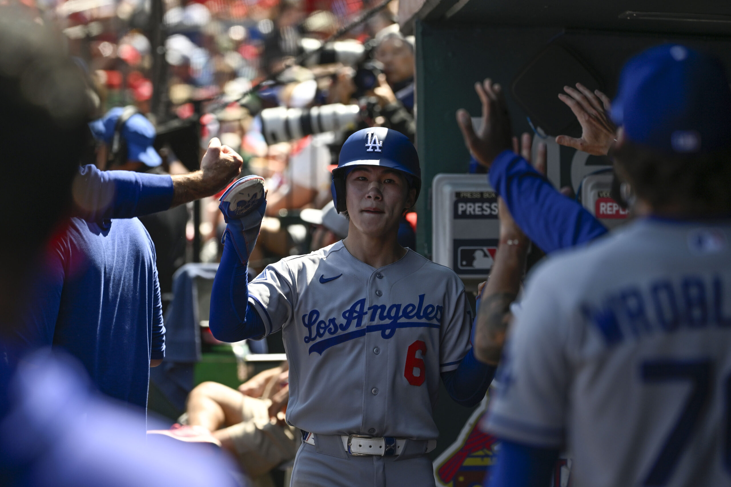 May 3, 2026; St. Louis, Missouri, USA; Los Angeles Dodgers shortstop Hyeseong Kim (6) is congratulated after scoring a run against the St. Louis Cardinals in the fifth inning at Busch Stadium. Mandatory Credit: Joe Puetz-Imagn Images
