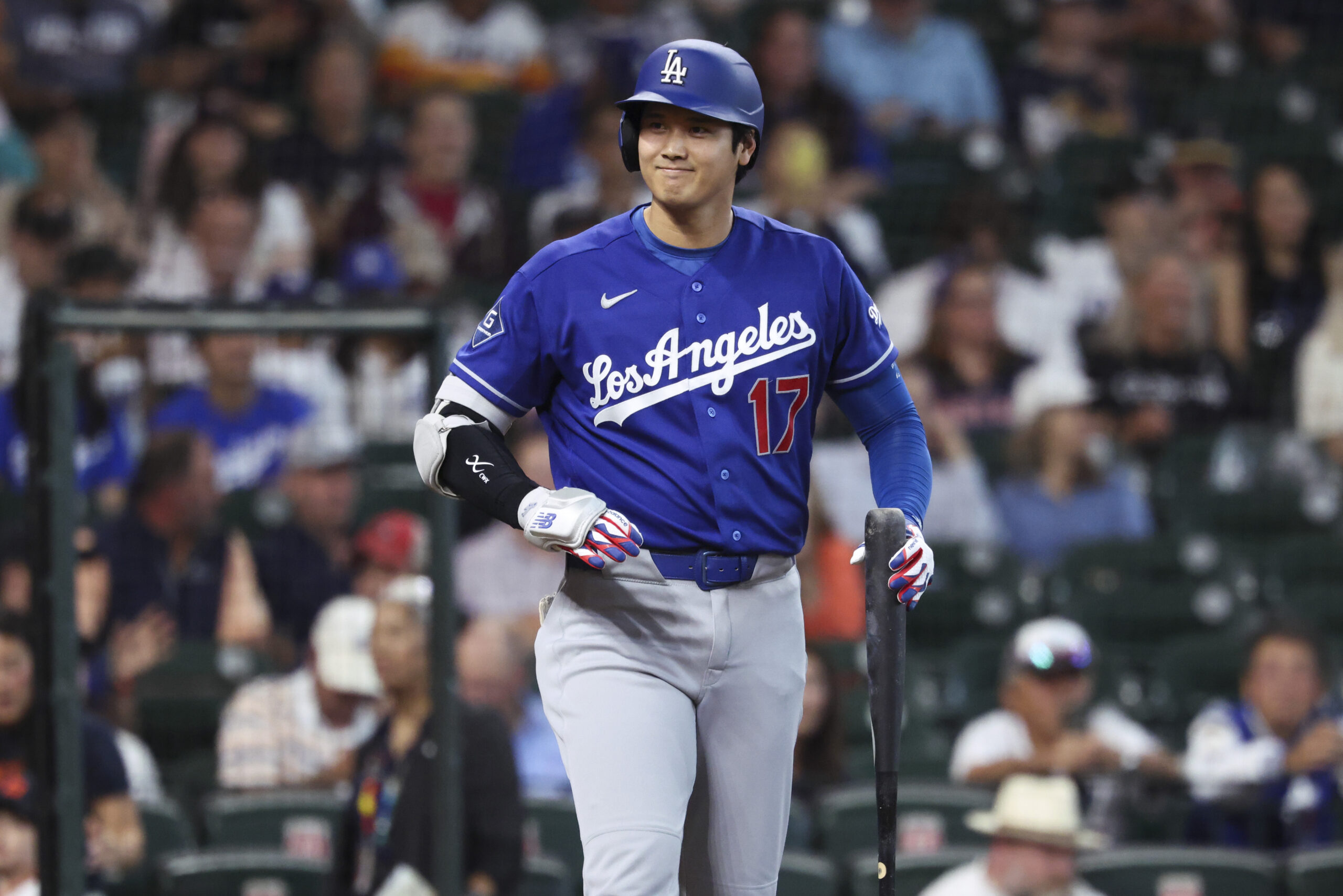 May 4, 2026; Houston, Texas, USA; Los Angeles Dodgers designated hitter Shohei Ohtani (17) smiles towards the Houston Astros dugout before batting during the first inning at Daikin Park. Mandatory Credit: Troy Taormina-Imagn Images