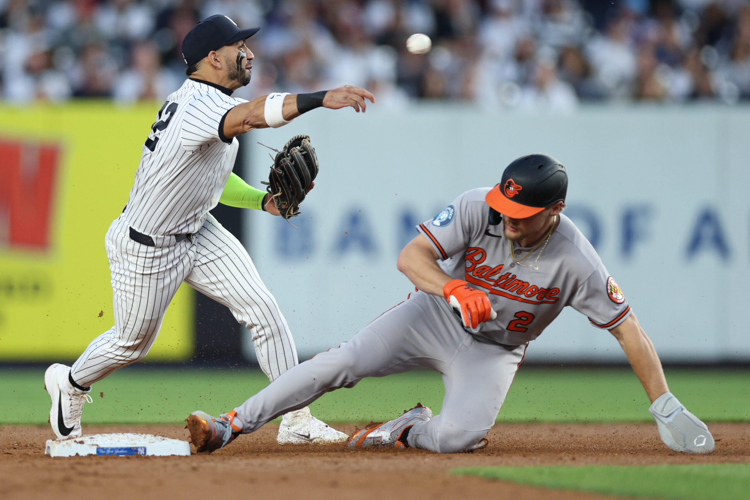 May 4, 2026; Bronx, New York, USA;  New York Yankees shortstop Jose Caballero (72) forces out Baltimore Orioles shortstop Gunnar Henderson (2) at second base and throws to first to complete the double play on a ball hit by catcher Adley Rutschman  (not pictured) during the third inning at Yankee Stadium. Mandatory Credit: Vincent Carchietta-Imagn Images