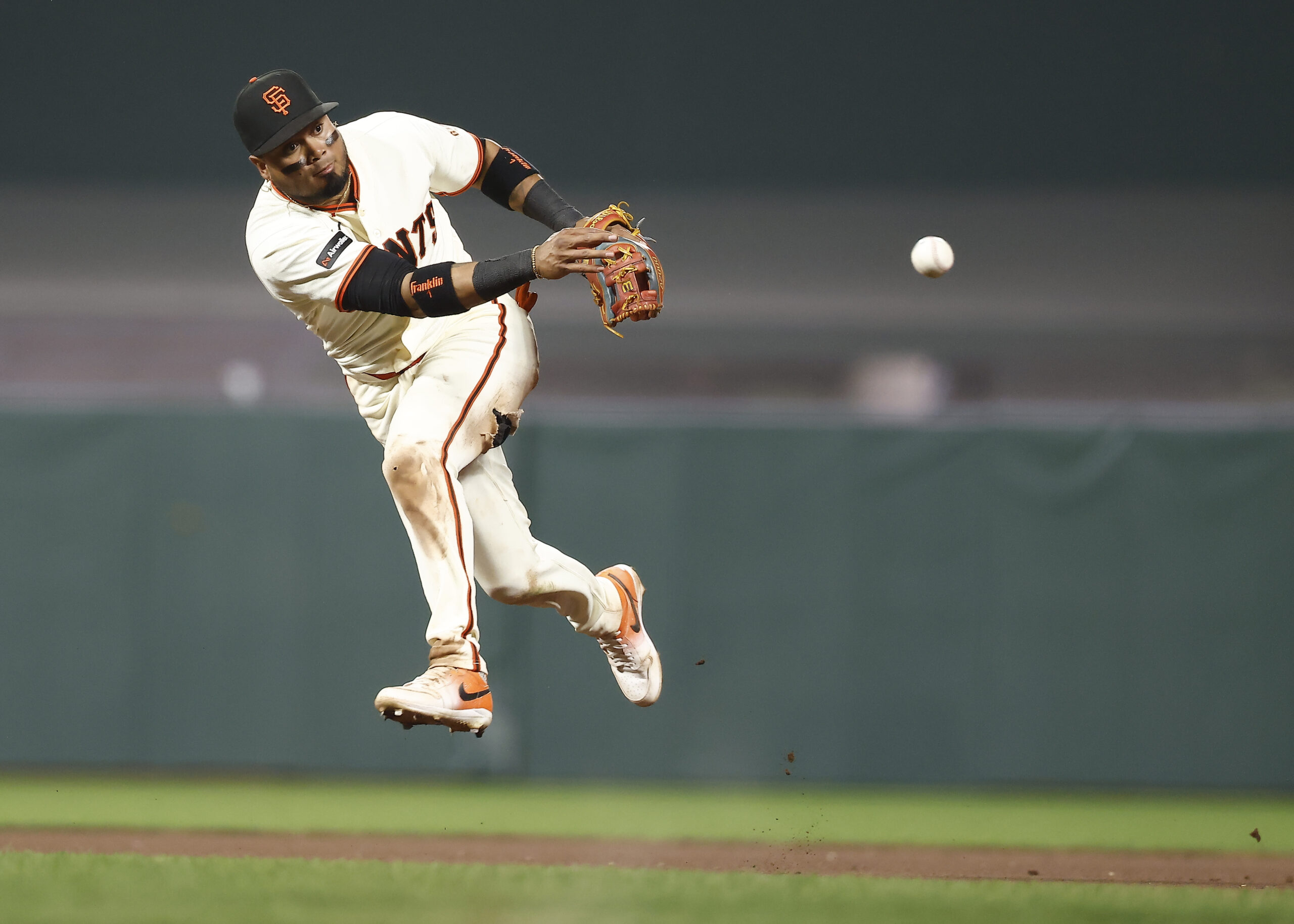 May 4, 2026; San Francisco, California, USA; San Francisco Giants second baseman Luis Arraez (1) throws the ball to first base against the San Diego Padres during the ninth inning at Oracle Park. Mandatory Credit: Kelley L Cox-Imagn Images