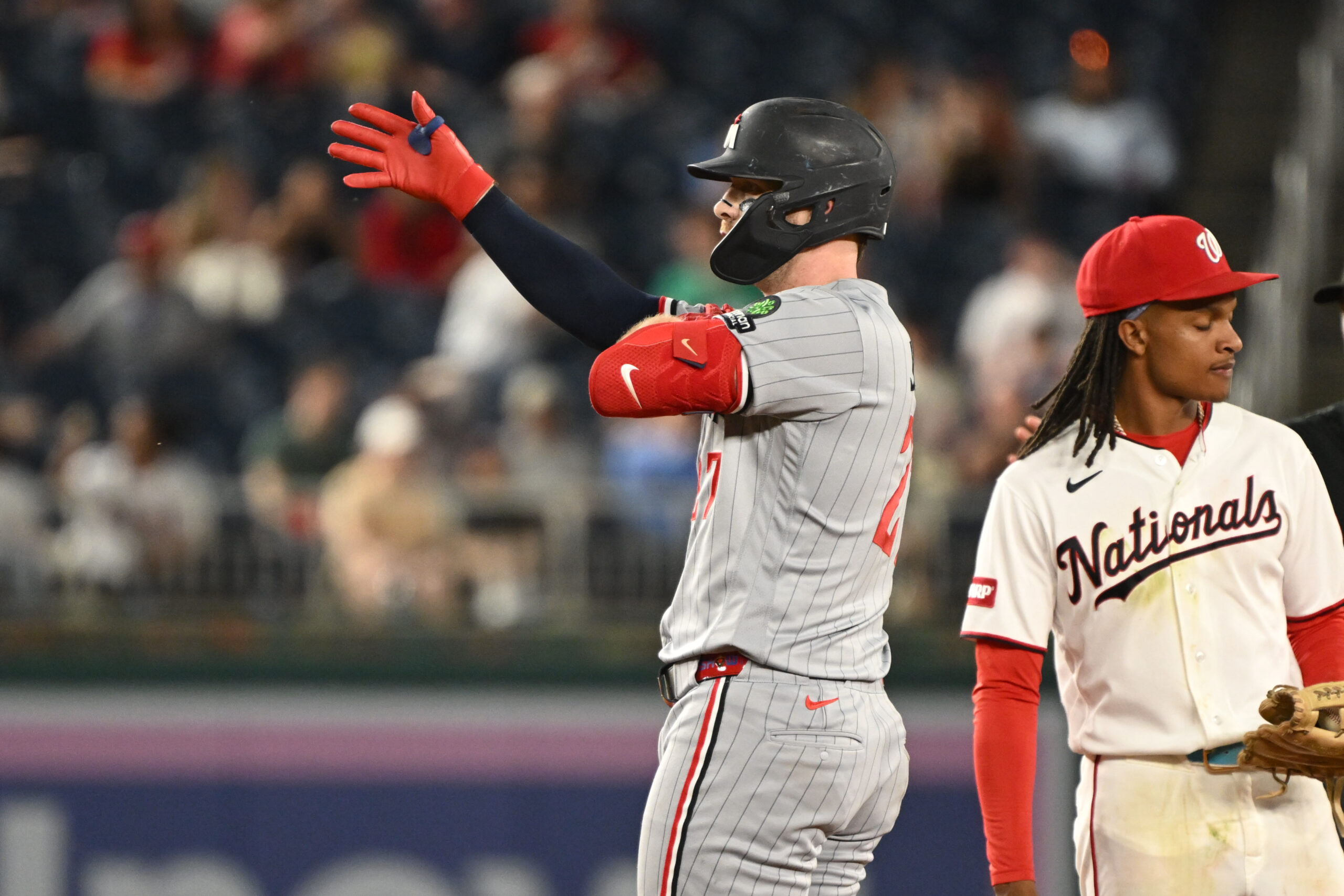 May 5, 2026; Washington, District of Columbia, USA;  Minnesota Twins catcher Ryan Jeffers (27) reacts after hitting a double against the Washington Nationals during the seventh inning at Nationals Park. Mandatory Credit: Rafael Suanes-Imagn Images