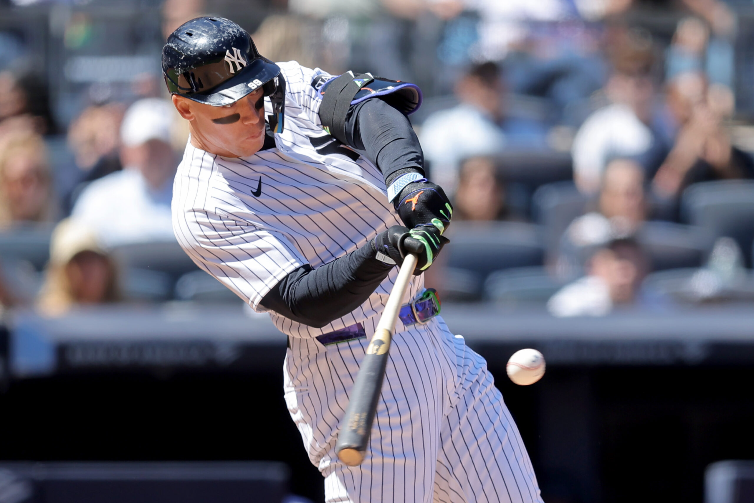 May 7, 2026; Bronx, New York, USA; New York Yankees designated hitter Aaron Judge (99) hits an RBI single against the Texas Rangers during the sixth inning at Yankee Stadium. Mandatory Credit: Brad Penner-Imagn Images