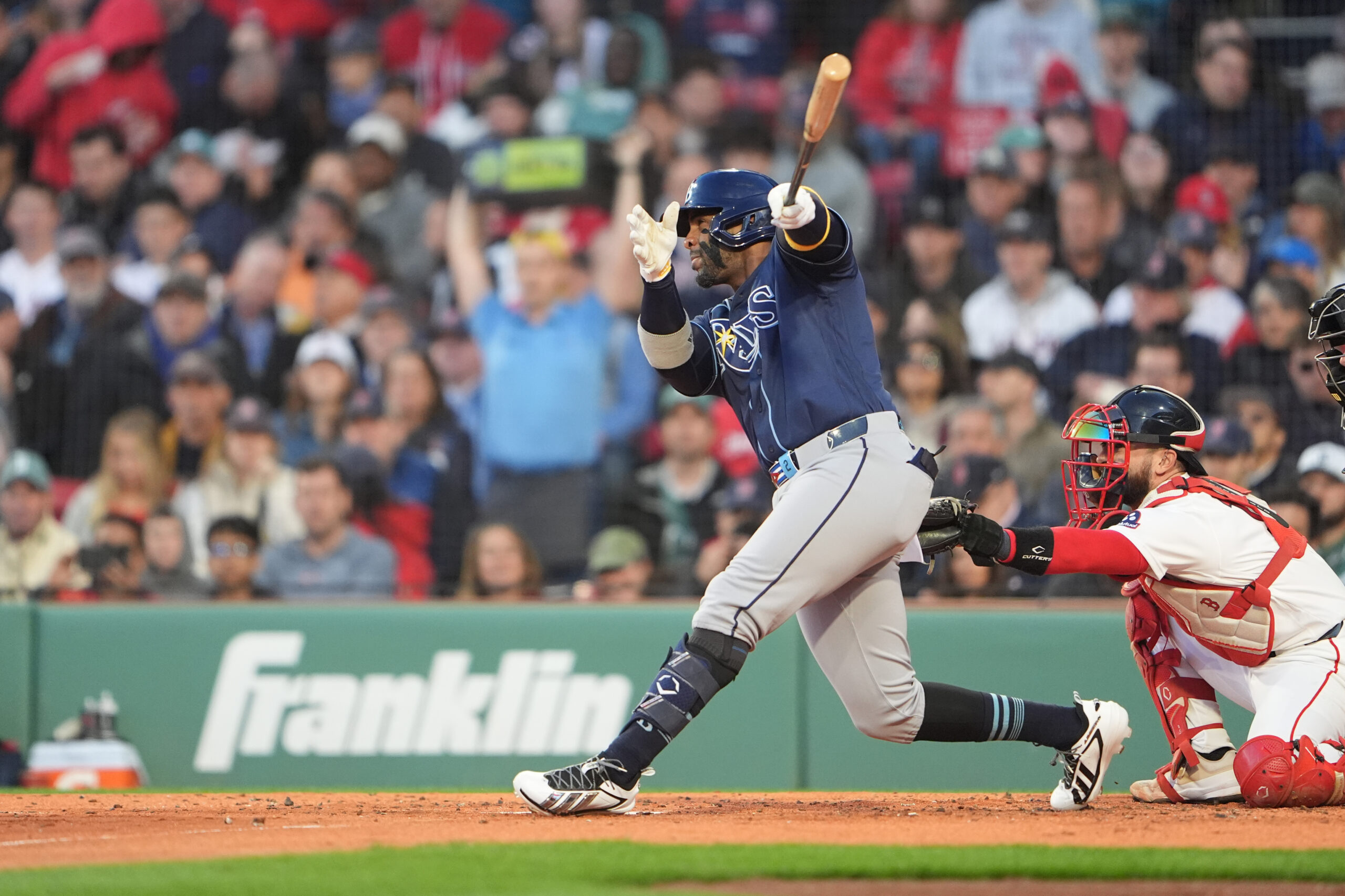 May 7, 2026; Boston, Massachusetts, USA; Tampa Bay Rays designated hitter Yandy Diaz (2) hits a sacrifice fly ball against the Boston Red Sox during the second inning at Fenway Park. Mandatory Credit: Gregory Fisher-Imagn Images
