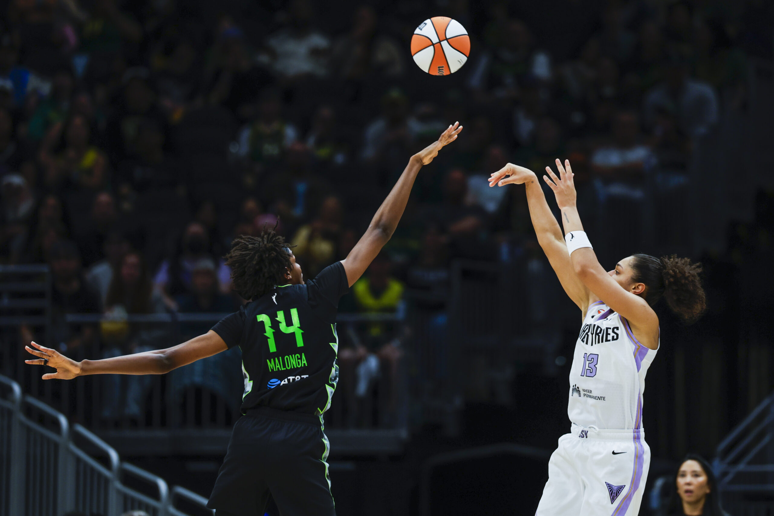 May 8, 2026; Seattle, Washington, USA; Golden State Valkyries forward Janelle Salaun (13) shoots against Seattle Storm center Dominique Malonga (14) during the third quarter at Climate Pledge Arena. Mandatory Credit: Joe Nicholson-Imagn Images