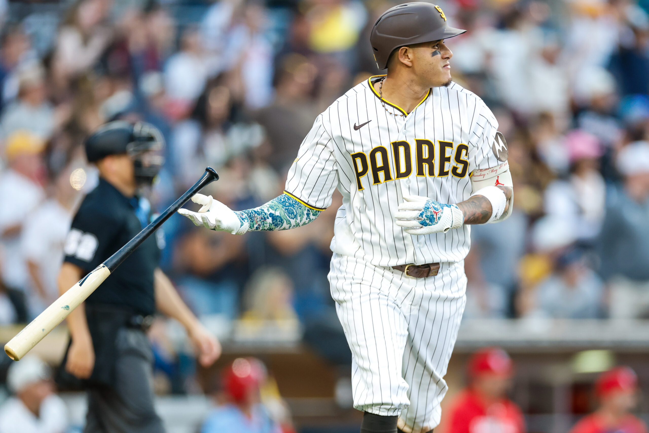 May 9, 2026; San Diego, California, USA; San Diego Padres third baseman Manny Machado (13) hits a one run home run during the eighth inning against the St. Louis Cardinals at Petco Park. Mandatory Credit: David Frerker-Imagn Images