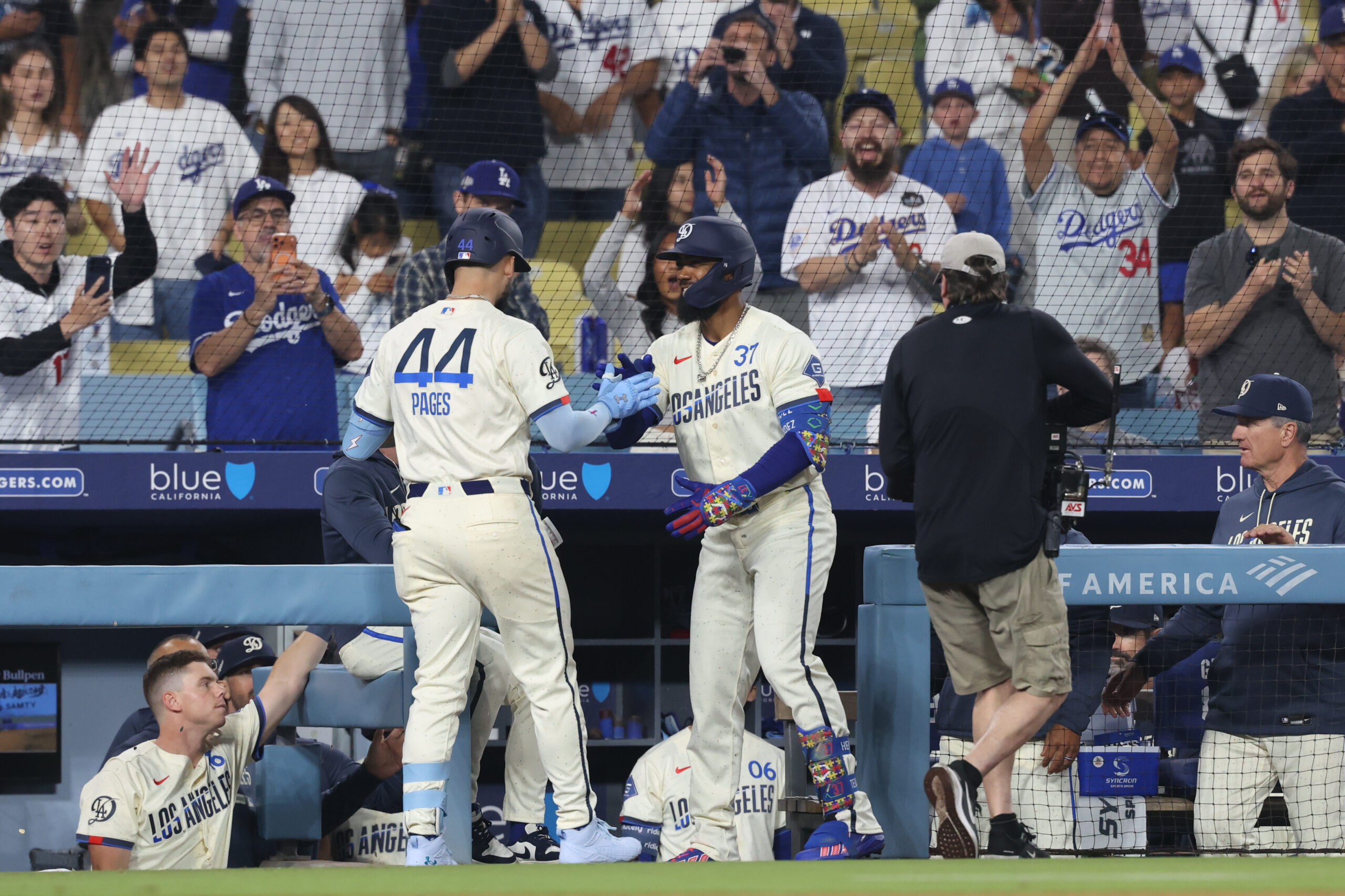 May 9, 2026; Los Angeles, California, USA;  Los Angeles Dodgers center fielder Andy Pages (44)  is greeted at the dugout steps by left fielder Teoscar Hernández (37) after hitting two-run home run against the Atlanta Braves two-run home run at Dodger Stadium. Mandatory Credit: Kiyoshi Mio-Imagn Images