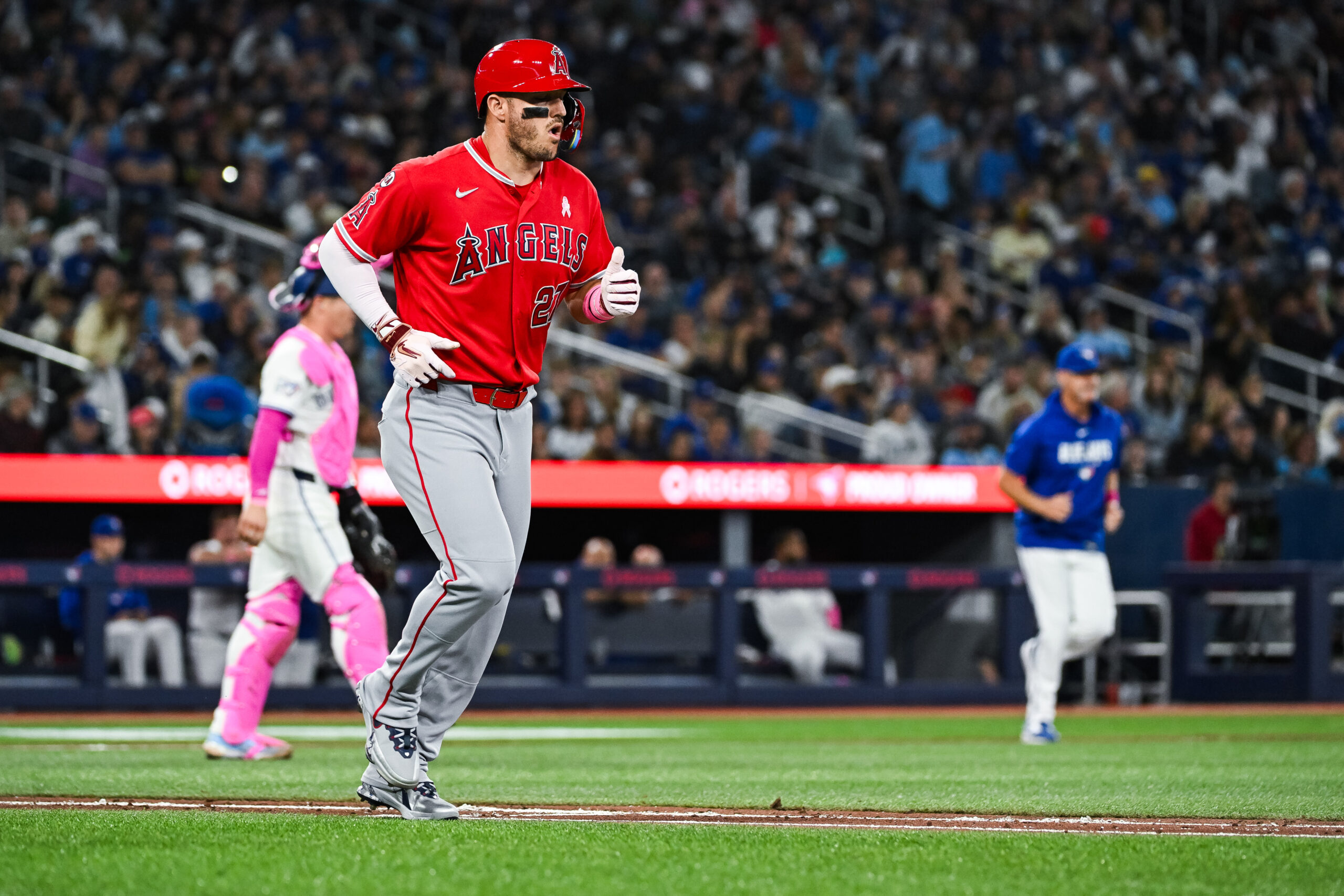 May 10, 2026; Toronto, Ontario, CAN; Los Angeles Angels center fielder Mike Trout (27) jogs towards the first base after being walked against the Toronto Blue Jays in the fifth inning at Rogers Centre. Mandatory Credit: David Kirouac-Imagn Images
