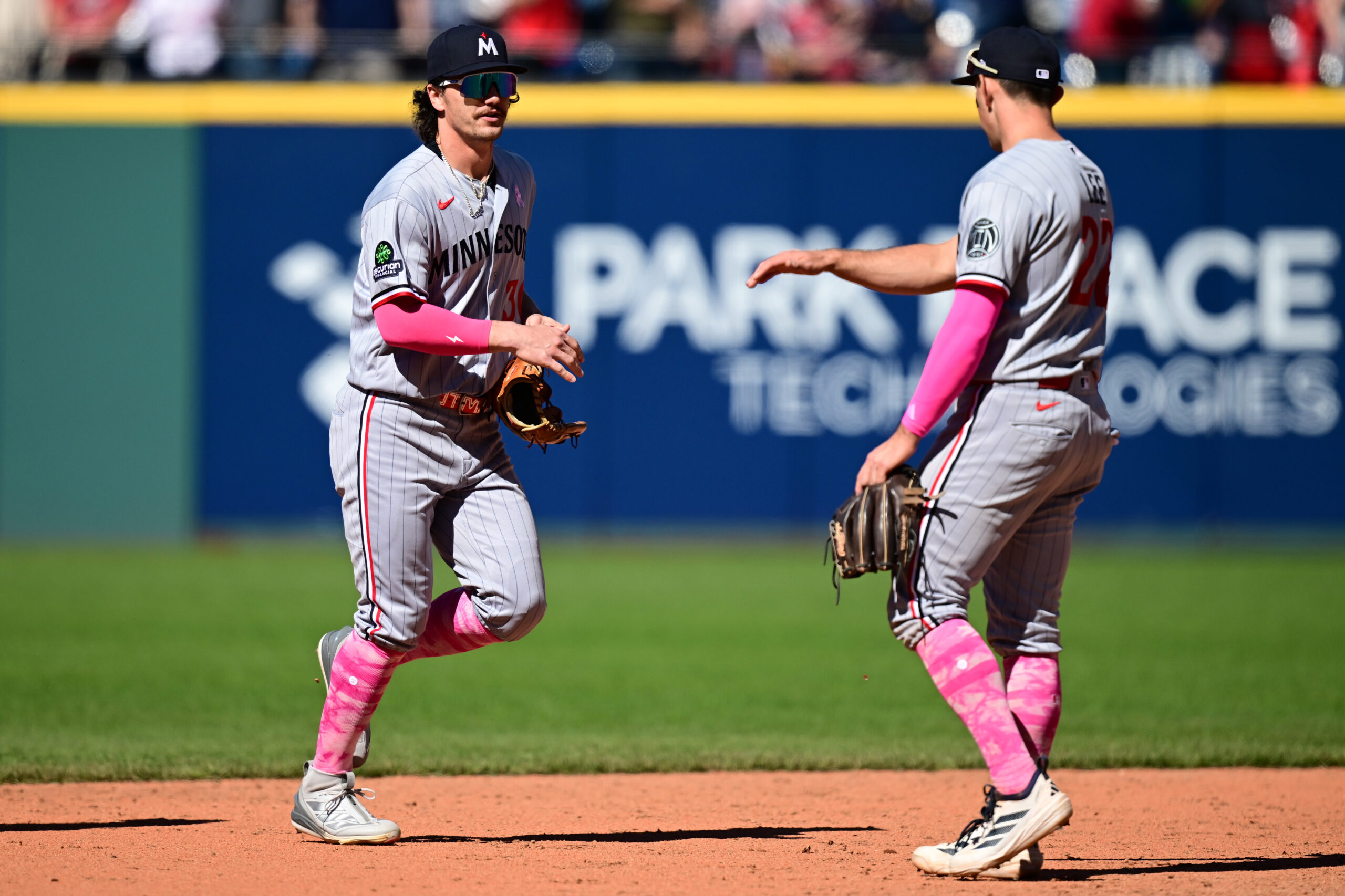 May 10, 2026; Cleveland, Ohio, USA; Minnesota Twins left fielder James Outman (30) is congratulated by Minnesota Twins short stop Brooks Lee (22) after the Twins defeated the Cleveland Guardians at Progressive Field. Mandatory Credit: David Dermer-Imagn Images