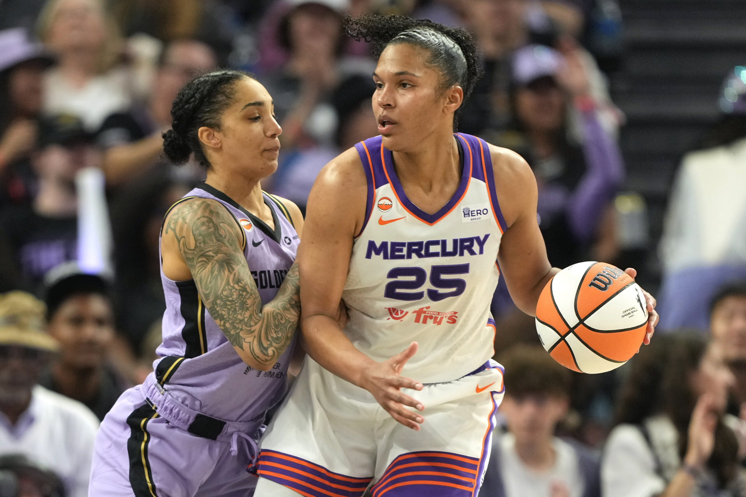 May 10, 2026; San Francisco, California, USA; Phoenix Mercury forward Alyssa Thomas (25) dribbles against Golden State Valkyries forward Gabby Williams (left) during the fourth quarter at Chase Center. Mandatory Credit: Darren Yamashita-Imagn Images