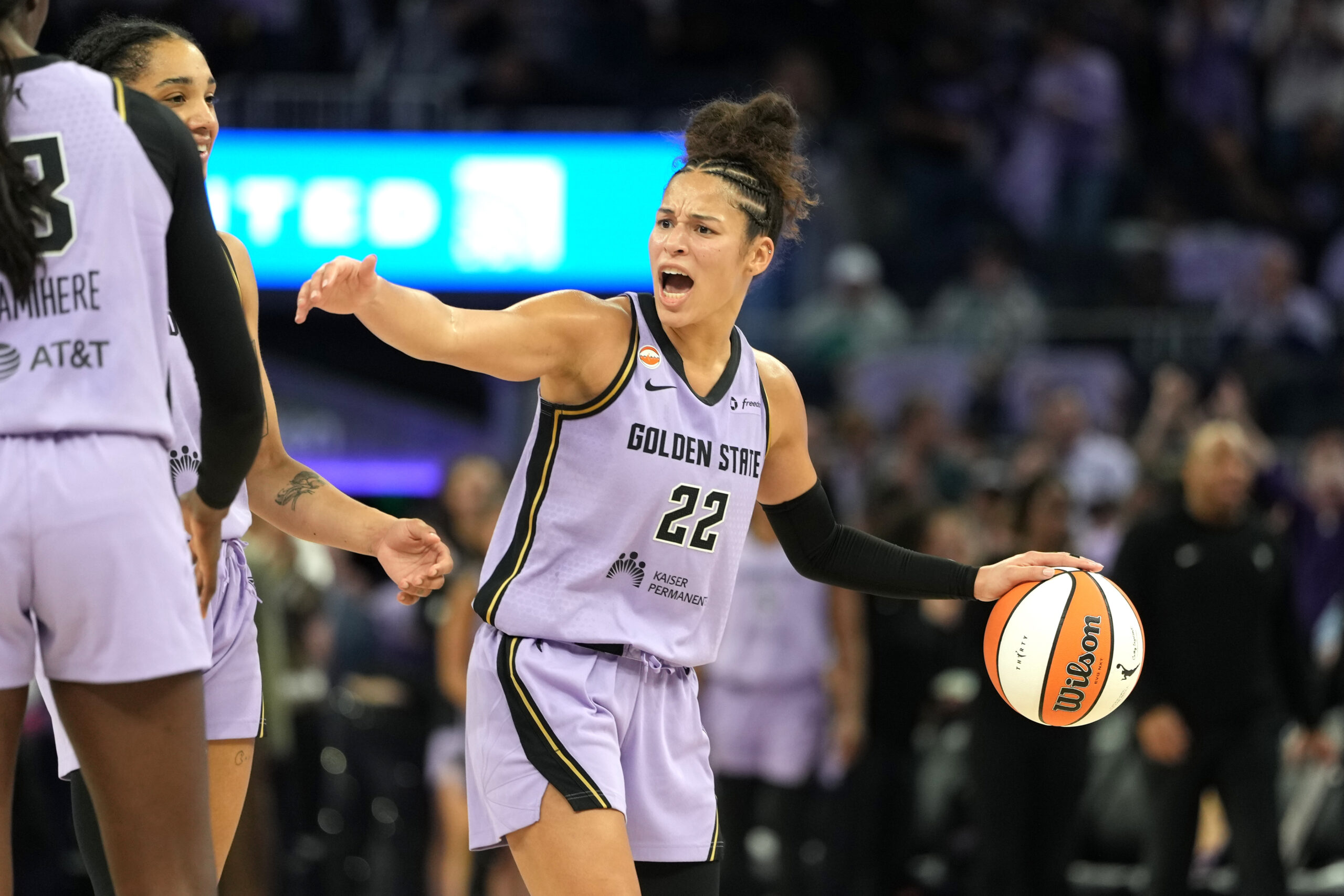 May 10, 2026; San Francisco, California, USA; Golden State Valkyries guard Veronica Burton (22) celebrates with forward Janelle Salaun (far left) and forward Gabby Williams (obscured left) during the fourth quarter against the Phoenix Mercury at Chase Center. Mandatory Credit: Darren Yamashita-Imagn Images