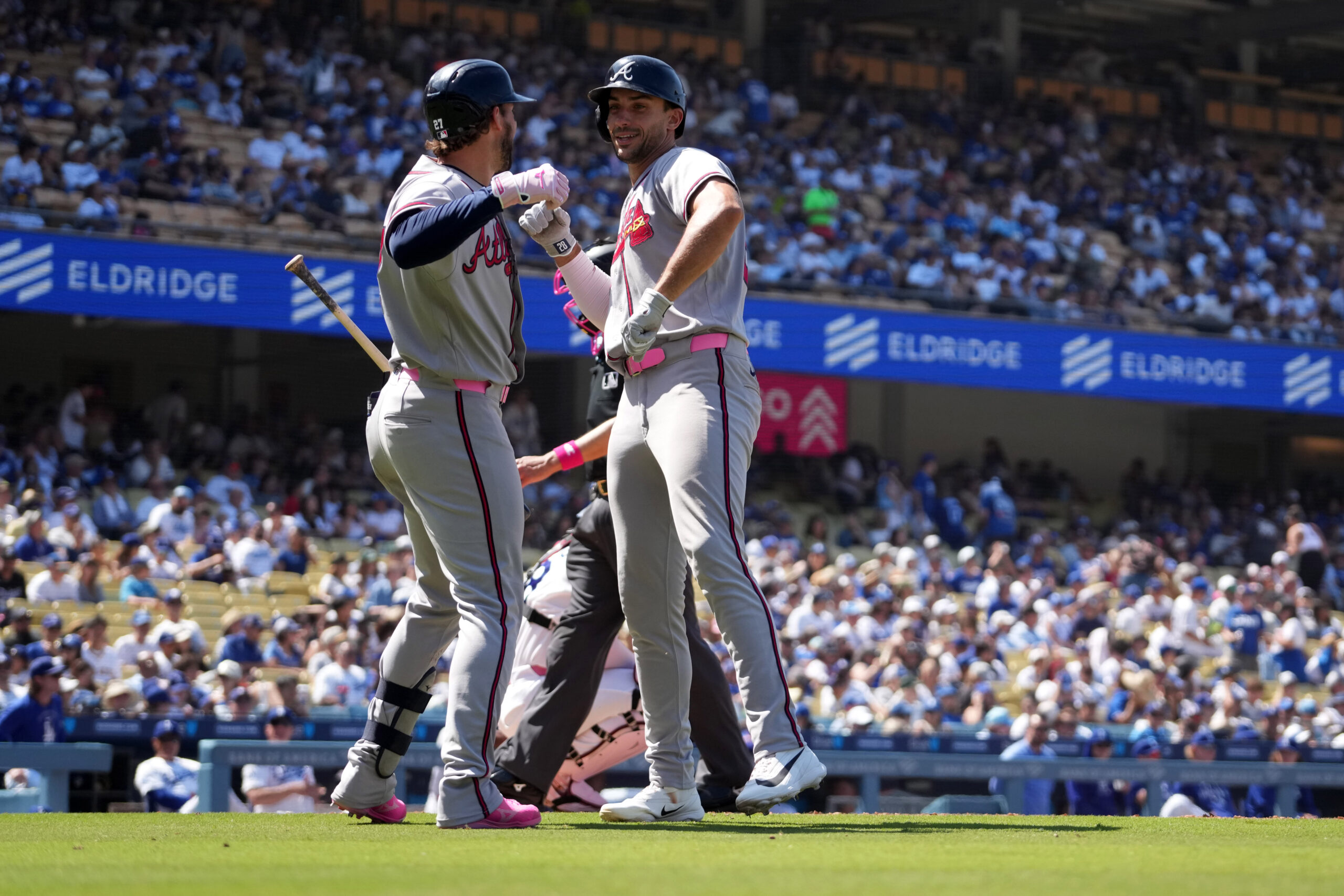 May 10, 2026; Los Angeles, California, USA; Atlanta Braves first baseman Matt Olson (right) celebrates with third baseman Austin Riley (27) after hitting a home run in the ninth inning against the Los Angeles Dodgers at Dodger Stadium. Mandatory Credit: Kirby Lee-Imagn Images