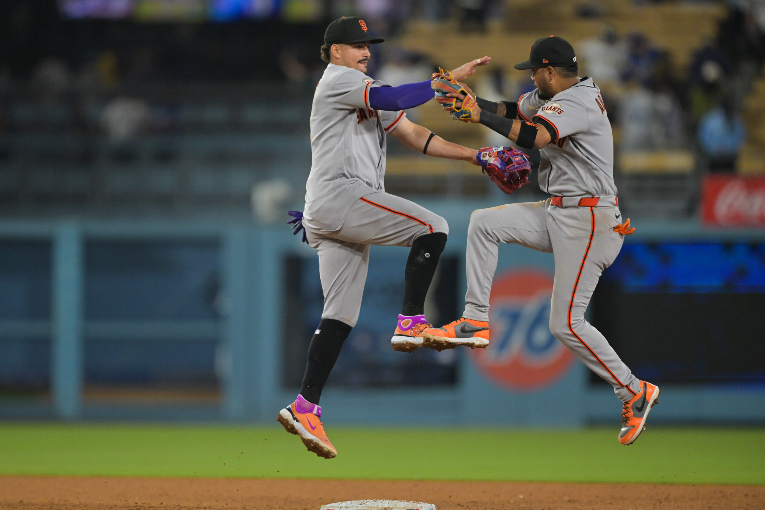 May 11, 2026; Los Angeles, California, USA; San Francisco Giants shortstop Willy Adames (2) and second baseman Luis Arraez (1)  celebrate after defeating the Los Angeles Dodgers at Dodger Stadium. Mandatory Credit: Jayne Kamin-Oncea-Imagn Images