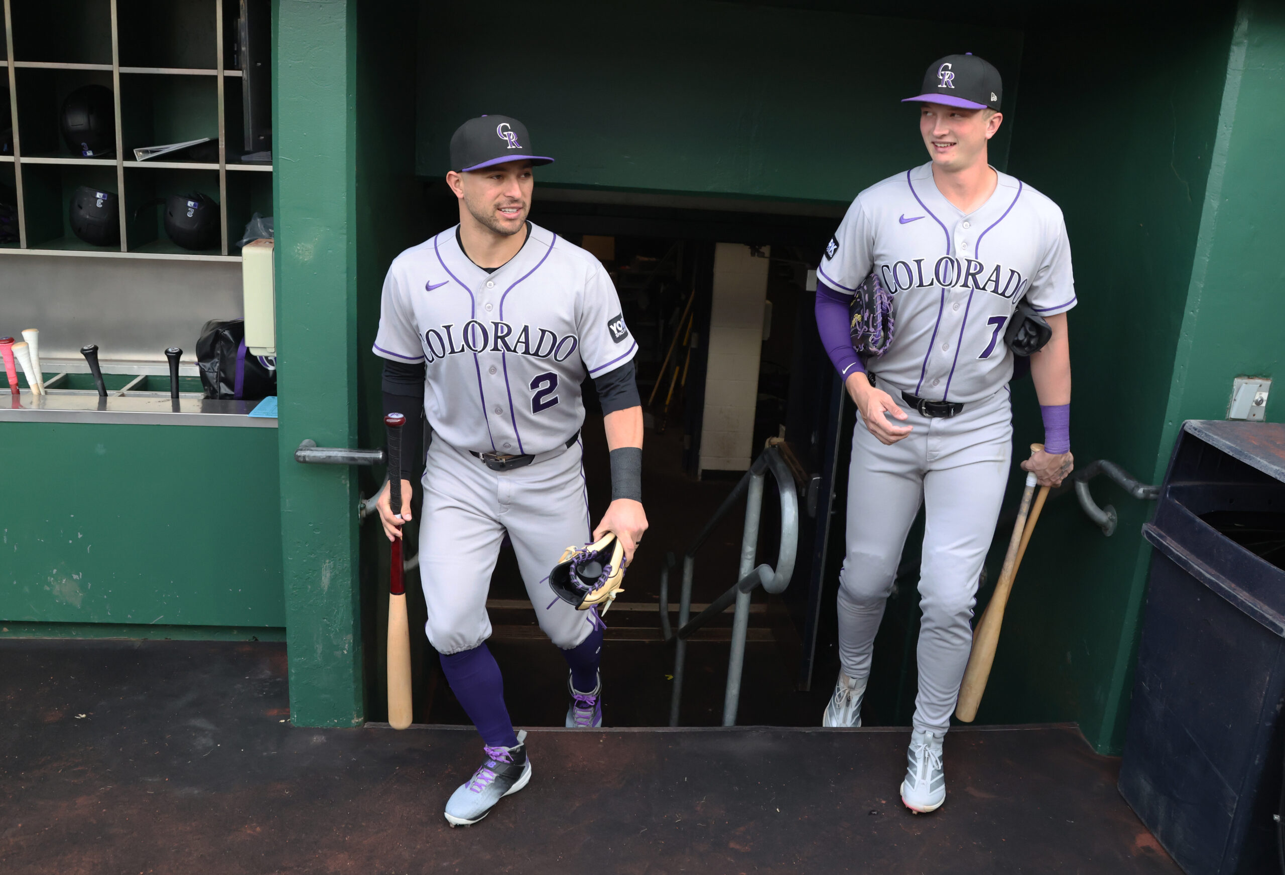 May 12, 2026; Pittsburgh, Pennsylvania, USA;  Colorado Rockies right fielder Tyler Freeman (2) and first baseman TJ Rumfield (7) enter the dugout to play the Pittsburgh Pirates at PNC Park. Mandatory Credit: Charles LeClaire-Imagn Images