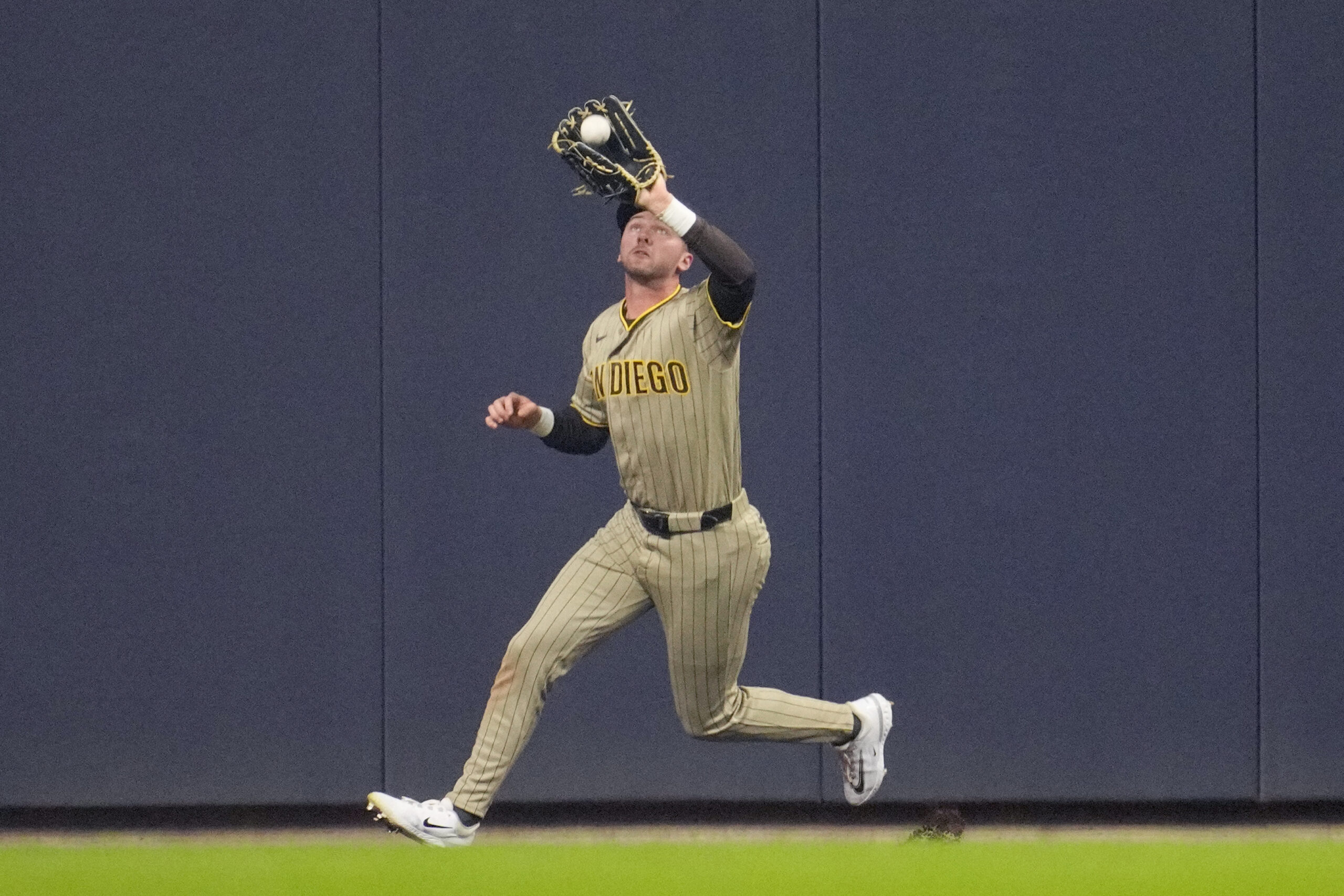 May 12, 2026; Milwaukee, Wisconsin, USA; San Diego Padres center fielder Jackson Merrill (3) catches a fly ball against the Milwaukee Brewers in the fourth inning at American Family Field. Mandatory Credit: Michael McLoone-Imagn Images