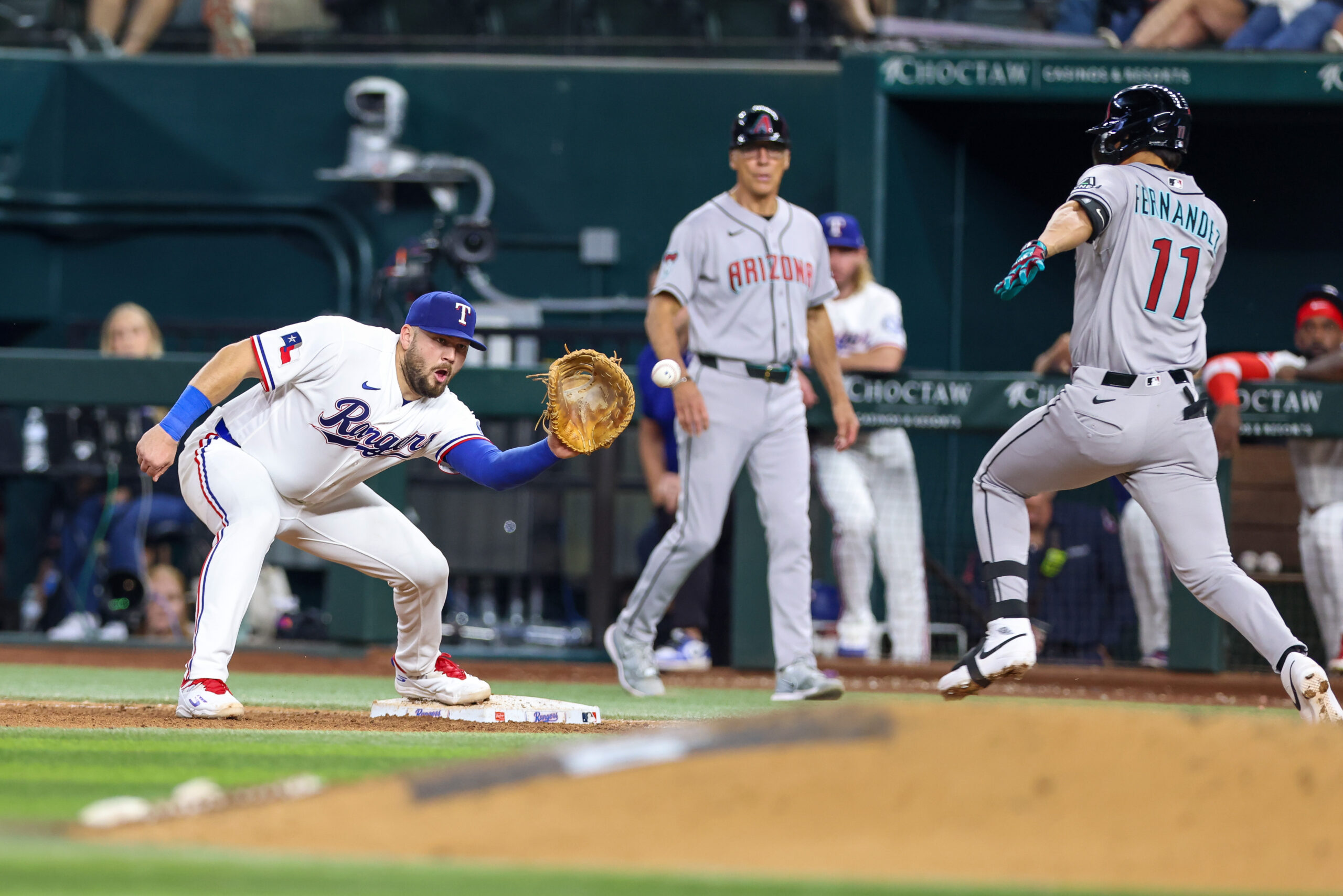 May 12, 2026; Arlington, Texas, USA; Texas Rangers first baseman Jake Burger (21) covers first base on a ground ball by Arizona Diamondbacks first baseman Jose Fernandez (11) during the eighth inning at Globe Life Field. Mandatory Credit: Andrew Dieb-Imagn Images