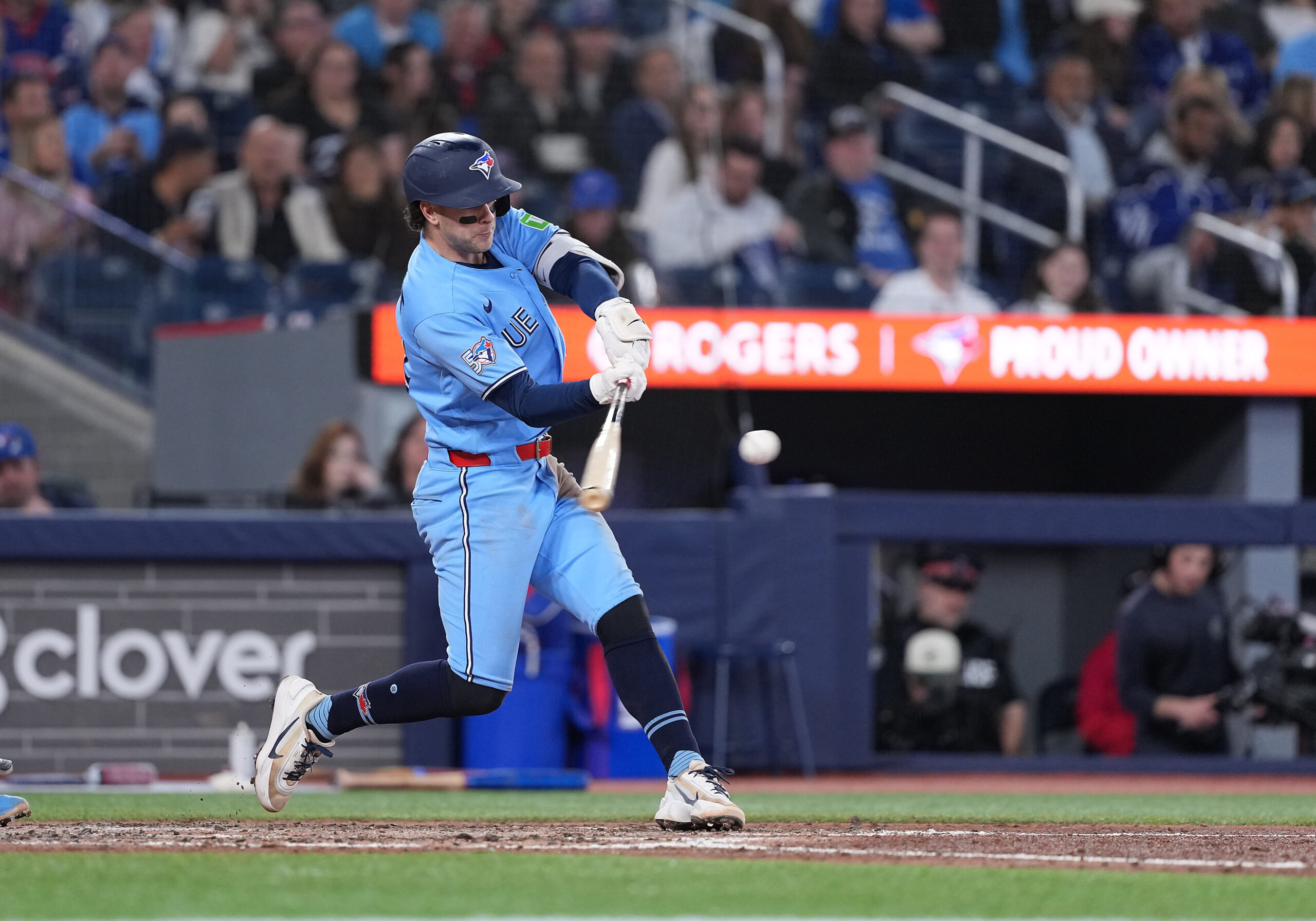 May 12, 2026; Toronto, Ontario, CAN; Toronto Blue Jays shortstop Ernie Clement (22) hits a single against the Tampa Bay Rays during the seventh inning at Rogers Centre. Mandatory Credit: Nick Turchiaro-Imagn Images