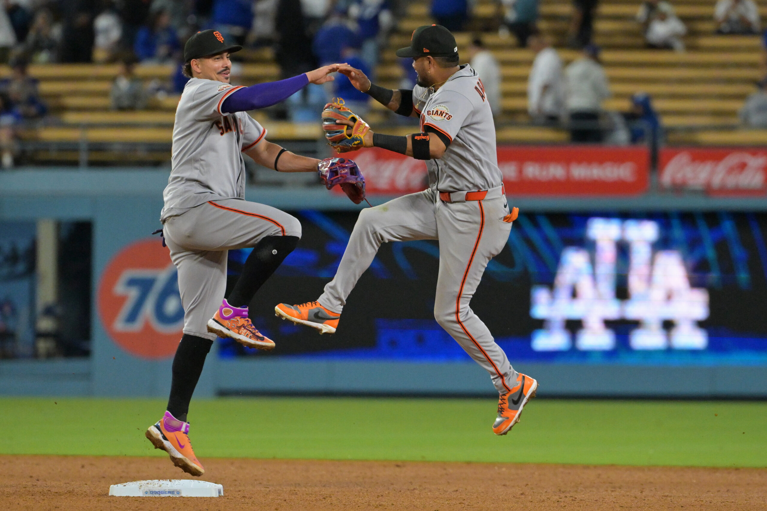 May 12, 2026; Los Angeles, California, USA; San Francisco Giants shortstop Willy Adames (2) and second baseman Luis Arraez (1) celebrate after defeating the Los Angeles Dodgers in the ninth inning at Dodger Stadium. Mandatory Credit: Jayne Kamin-Oncea-Imagn Images