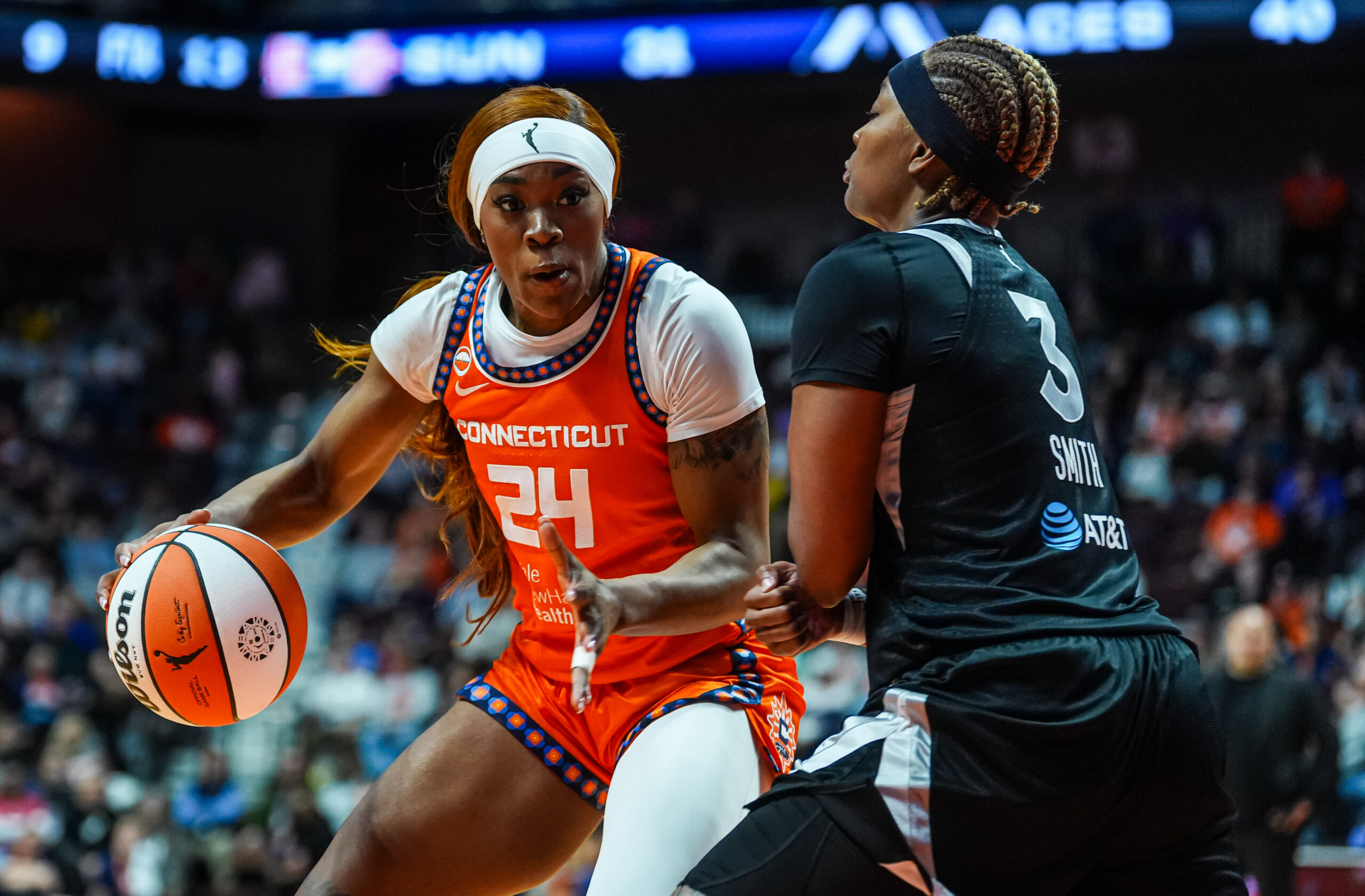 May 13, 2026; Uncasville, Connecticut, USA; Connecticut Sun forward Aneesah Morrow (24) drives the ball against Las Vegas Aces forward Nalyssa Smith (3) in the first half at Mohegan Sun Arena. Mandatory Credit: David Butler II-Imagn Images
