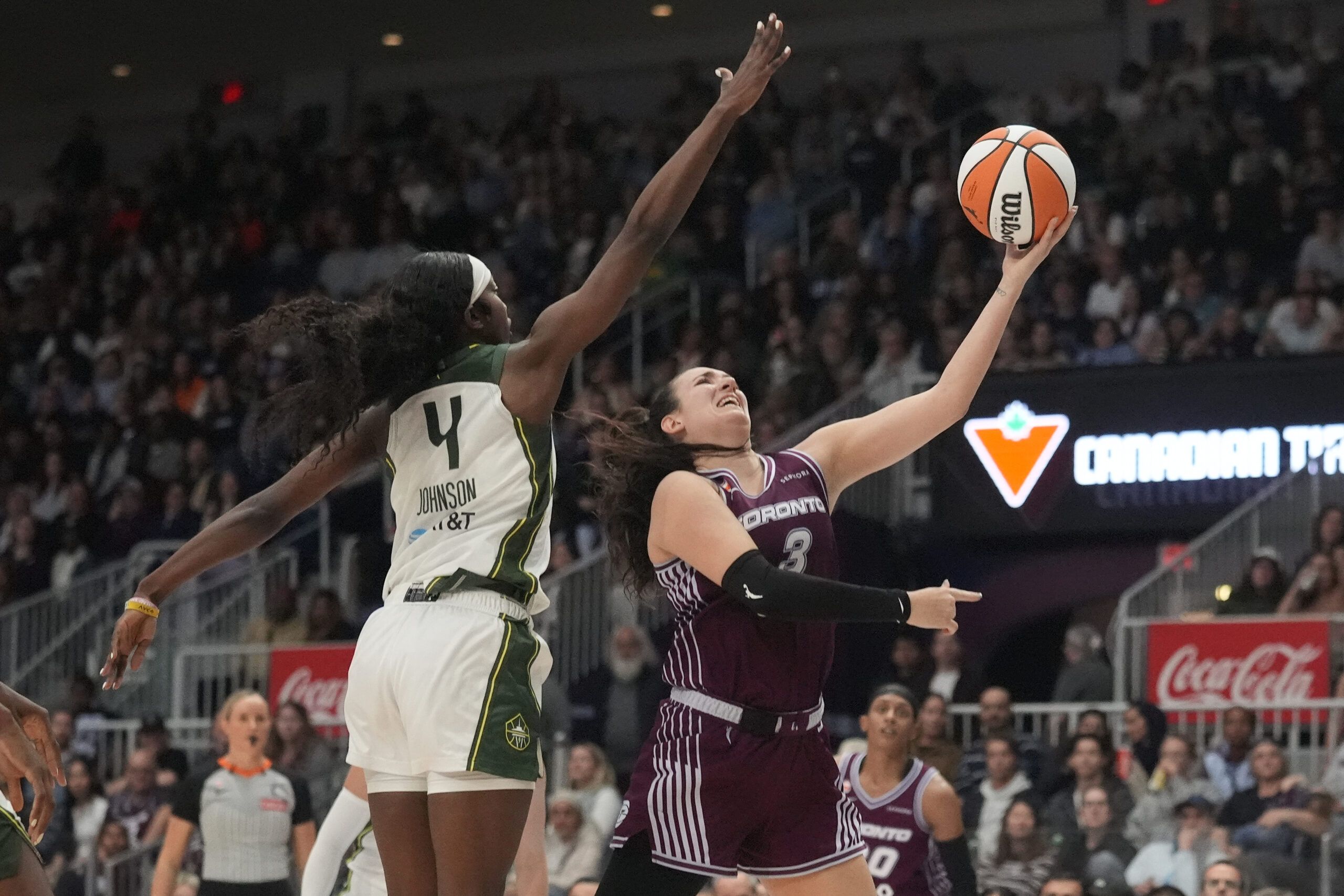 May 13, 2026; Toronto, Ontario, CAN; Toronto Tempo guard Marina Mabrey (3) goes up to make a basket against Seattle Storm guard Flau'Jae Johnson (4) during the second half at Coca-Cola Coliseum. Mandatory Credit: John E. Sokolowski-Imagn Images