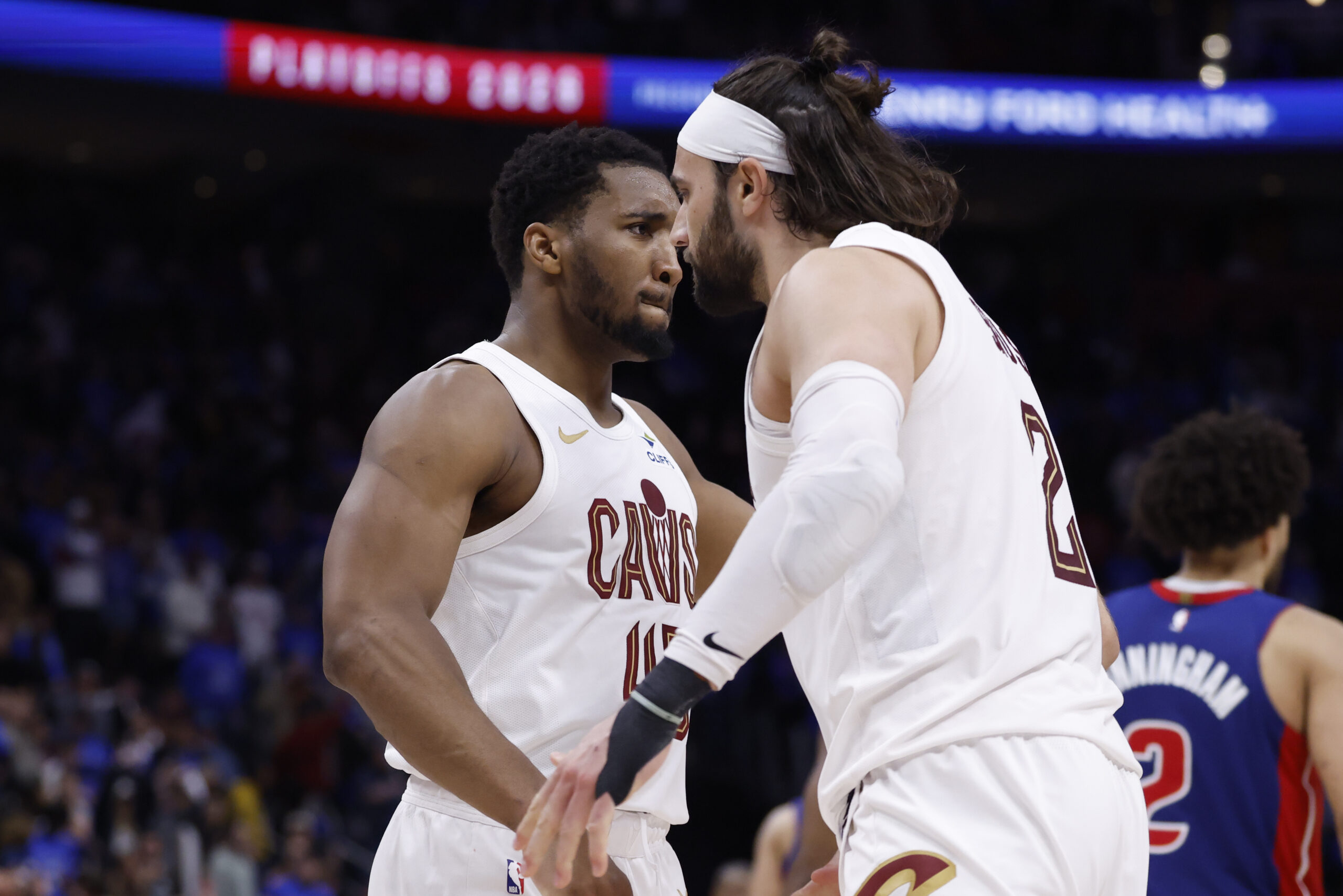 May 13, 2026; Detroit, Michigan, USA; Cleveland Cavaliers guard Donovan Mitchell (45) and guard/forward Max Strus (2) celebrates in overtime against the Detroit Pistons during game five of the second round of the 2026 NBA Playoffs at Little Caesars Arena. Mandatory Credit: Rick Osentoski-Imagn Images